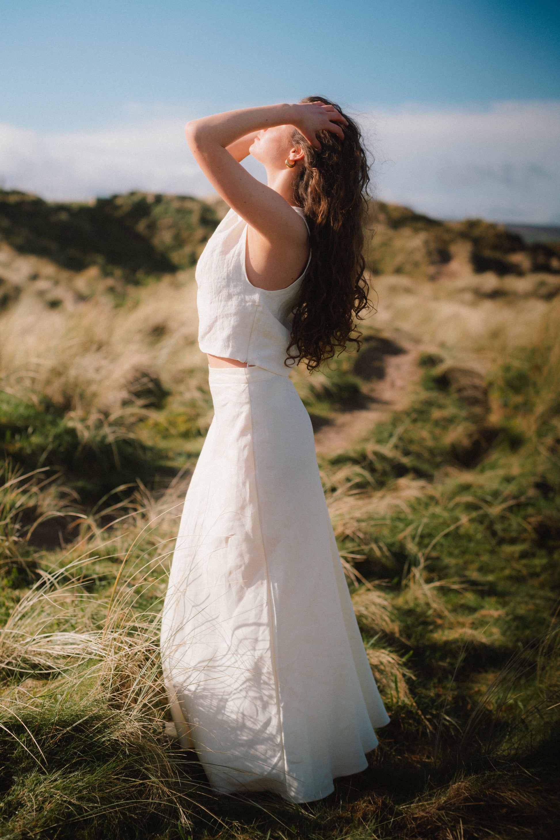 THE EVERYTHING SKIRT - IVORY | A new staple for SS24, the ‘everything’ skirt lives up to her name. An elegant bias cut makes this one feel really special to wear, whether you are pairing it with a simple tee, knit or our Evie top and heels for a more elev