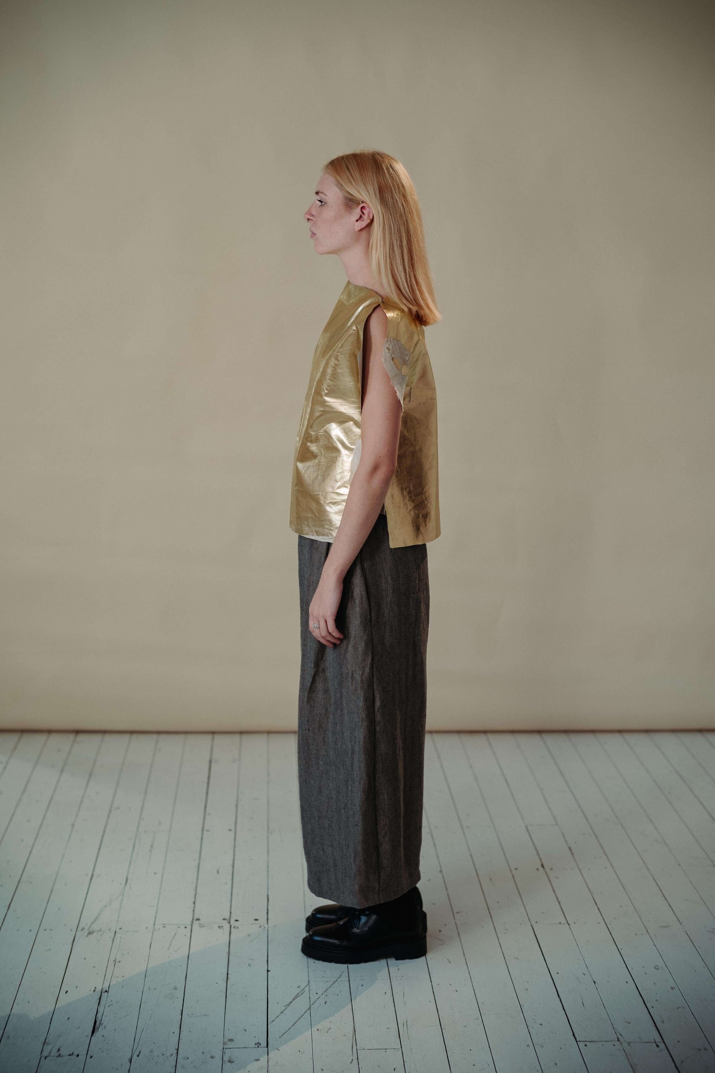 'FIND THE GOLD' VEST | Inspired by the signature golden circles of Irish artist Patrick Scott. The gold vest is the accent your staple wardrobe needs. Cut in the most simplified shape to allow the gold dry beetled linen have it's moment. Features adjustab