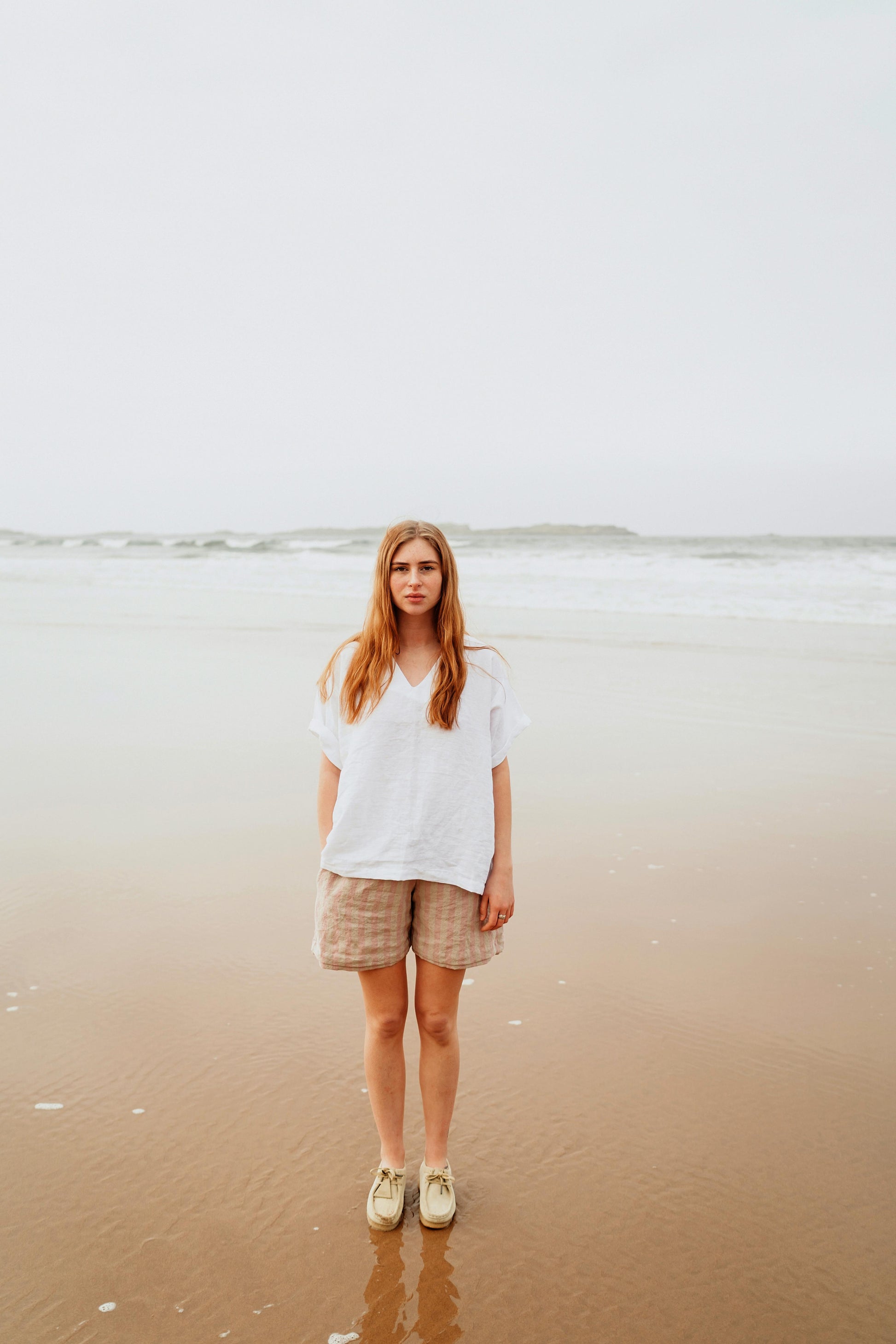 KIND TEE | WHITE | It's cool to be Kind Kind, the first four letters of our brand name - and what we hope to embody! The Kind Tee is a classic staple. Wear with 'V' at front or at the back for a higher neck line- a perfect layering piece. The tee features