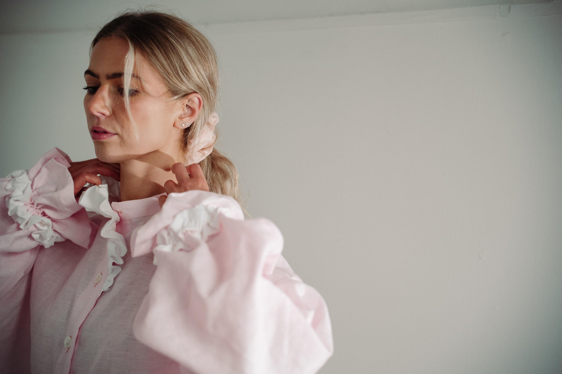 MARSHMALLOW BLOUSE | The Marshmallow Blouse is a fun interpretation of a favourite summer memory of toasting marshallows round the fire on the beach. The shirt features an assymetric frill detail on the collar - one side has structured white frills and th