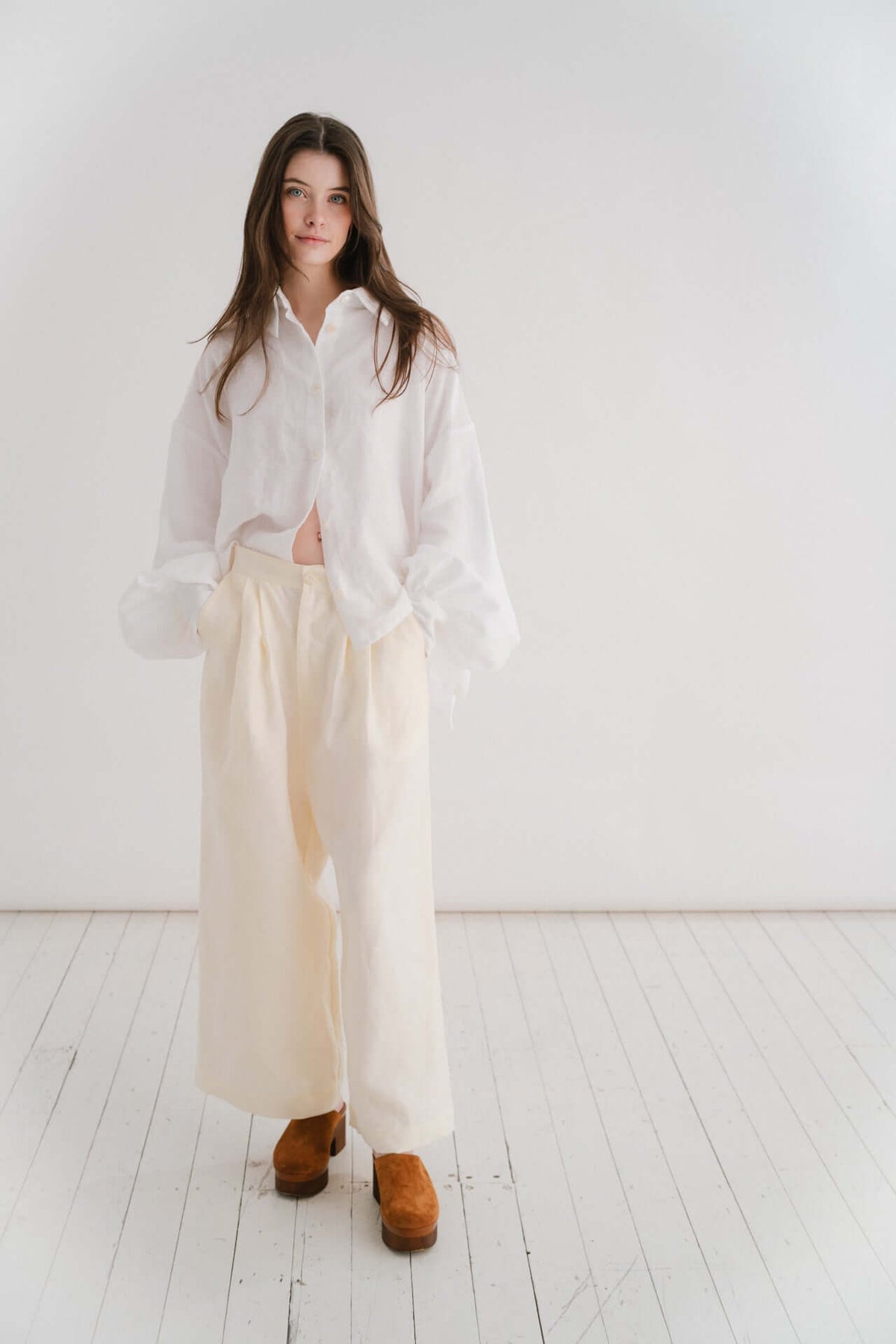 CADHLA SHIRT | WHITE | Relaxed, elegant and versatile. Cadhla - an Irish name translated as beauty. A Kindred favourite, and our first ever piece, this shirt examplifies the easy-wear ethos of the brand. Wear on one side with buttons for a beautiful dayti