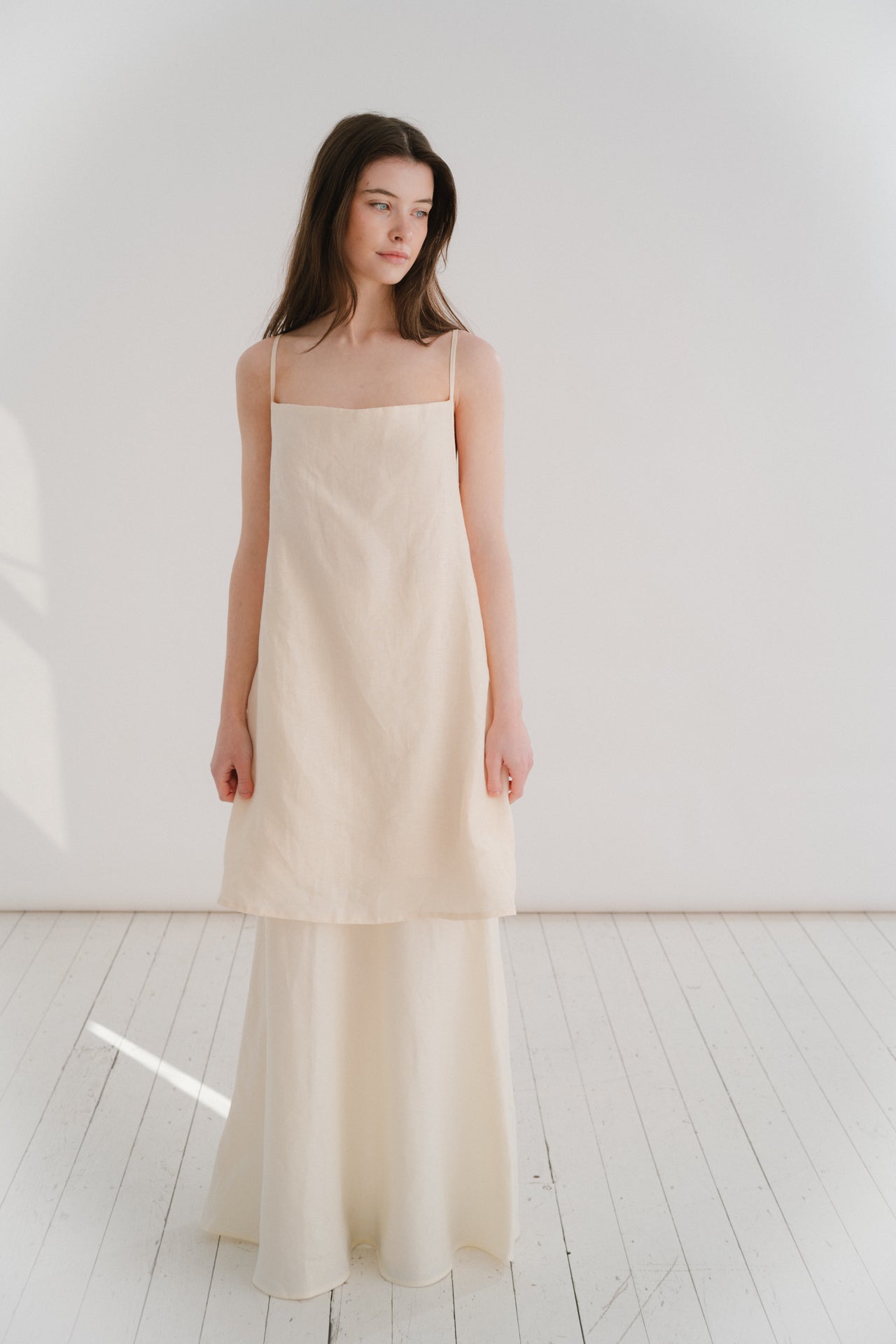 THE ELLA MINI | THE ELLA MINI A new shape for us for SS24, the Ella mini is one of our most simple and paired back silhouettes to date. She features a simple square neckline that cowls slightly. The delicate straps crossover each other at the back and att