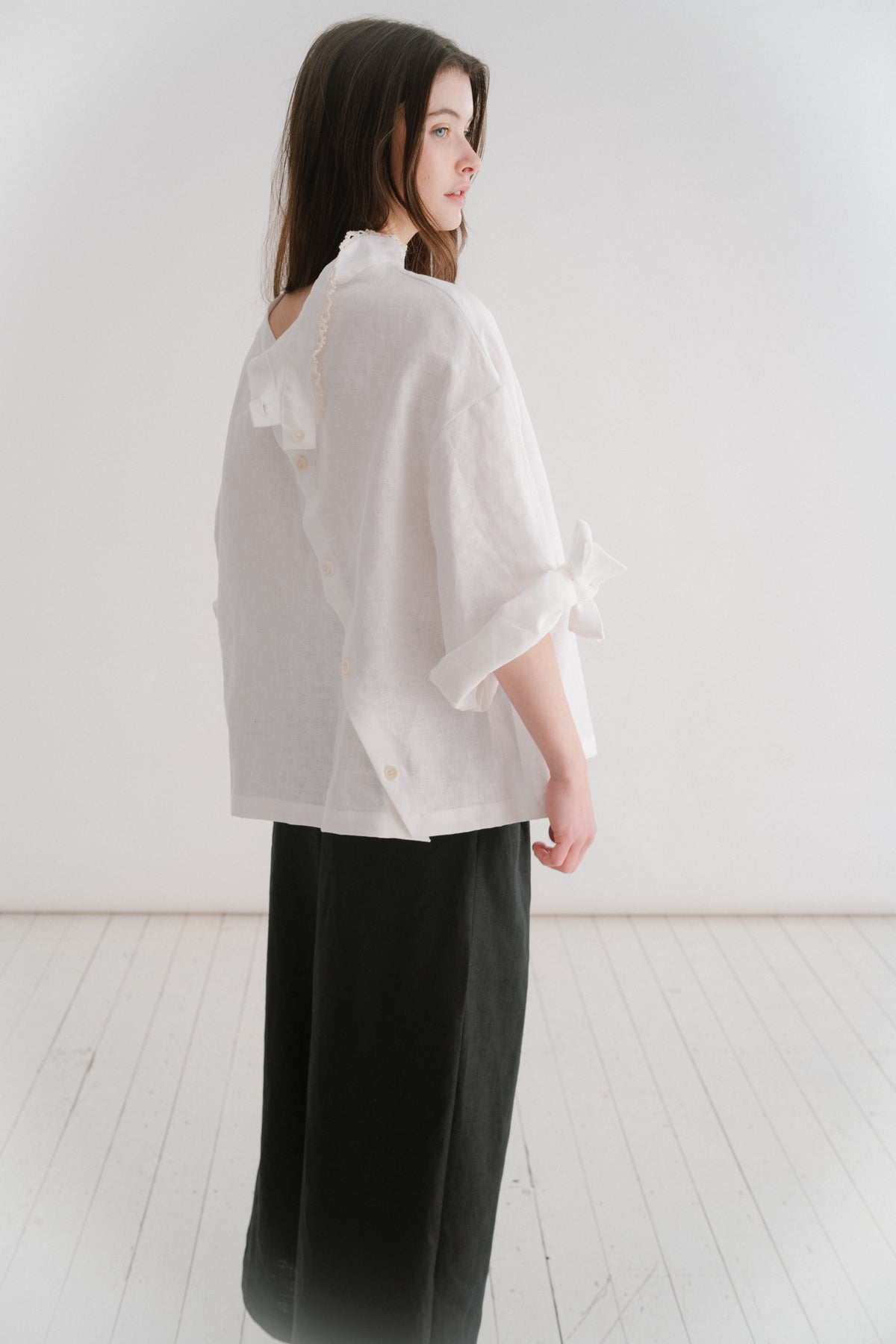VIVIENNE | IRISH CROCHET | This is a pretty special one- the shirt you will keep forever and pass on to your kin. Created with the purest white linen, the asymetric button placket and bows on the sleeves give it a fun and modern edge, while the addition o