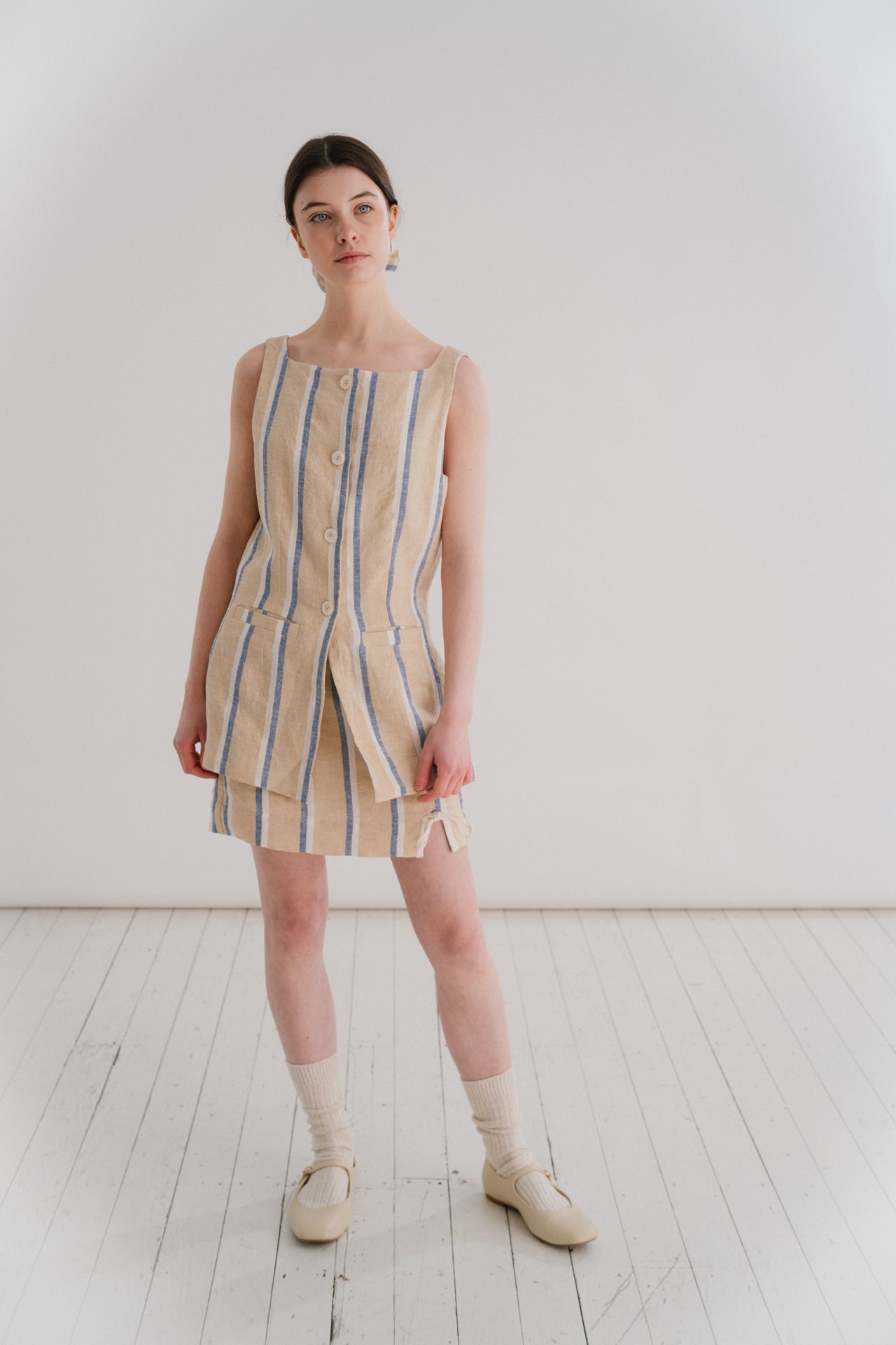 THE MIA MINI - STRIPE | Our very first mini - the Mia skirt has been designed to be the throw on piece that you will continue to reach for this Summer. A delicate bow detail on the front right gives it a little something special. Flat waistband at the fro