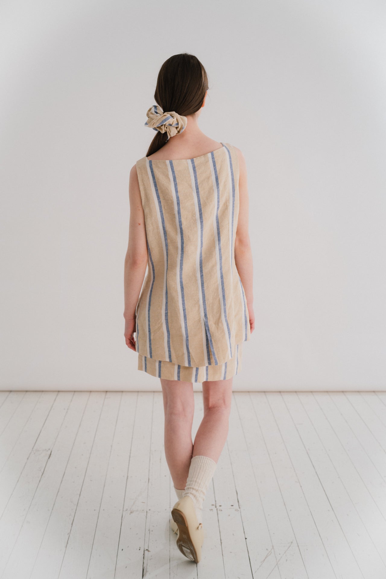 GRACE WAISTCOAT - STRIPE | A new shape for SS24, inspired by vintage safari wear. The Grace waistcoat is elegant in her simplicity. Cut with a flattering square neckline that is reflected in the arm hole detail, ever so slightly shaped to nip in at the wa
