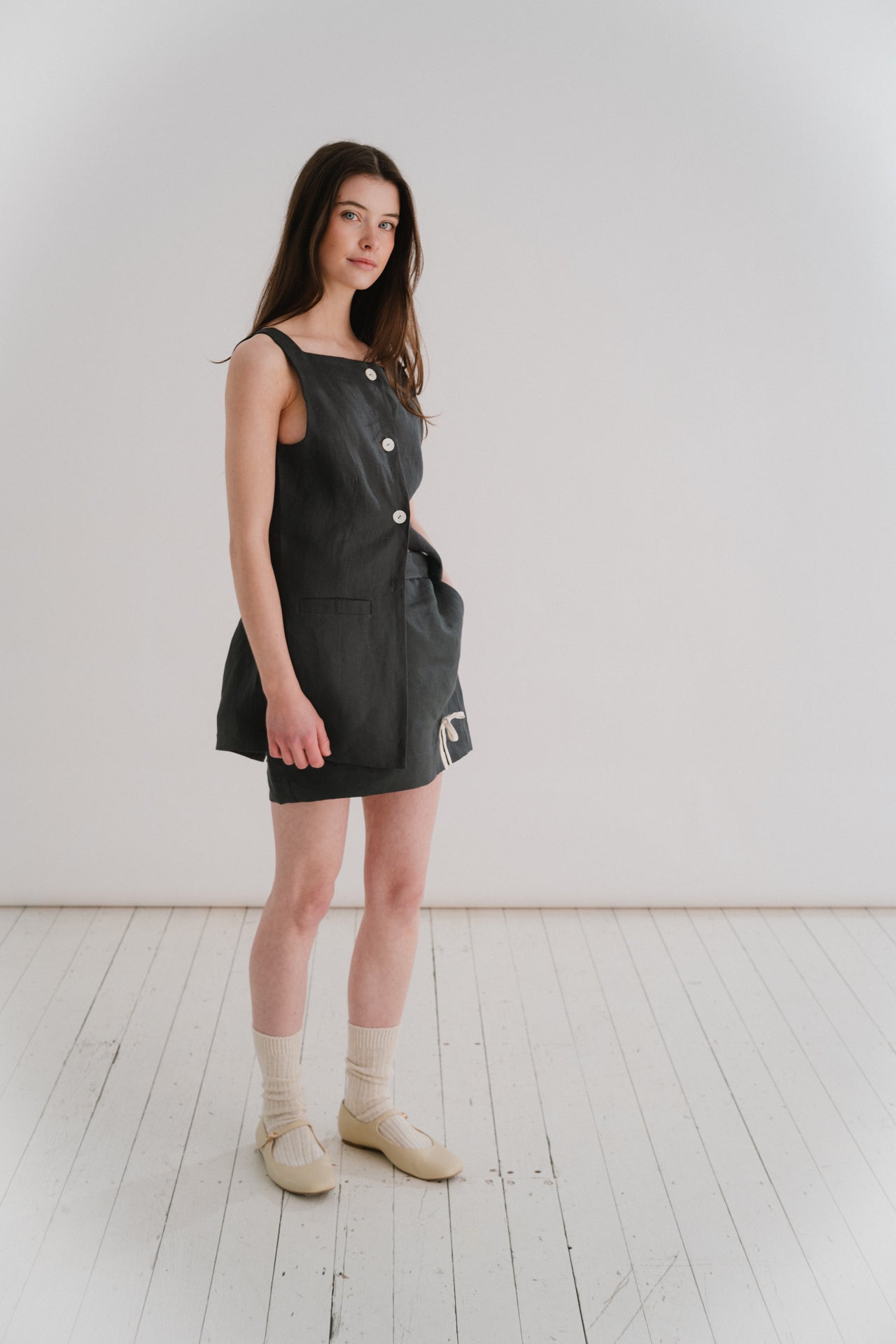 GRACE WAISTCOAT - MIDNIGHT | A new shape for SS24, inspired by vintage safari wear. The Grace waistcoat is elegant in her simplicity. Cut with a flattering square neckline that is reflected in the arm hole detail, ever so slightly shaped to nip in at the