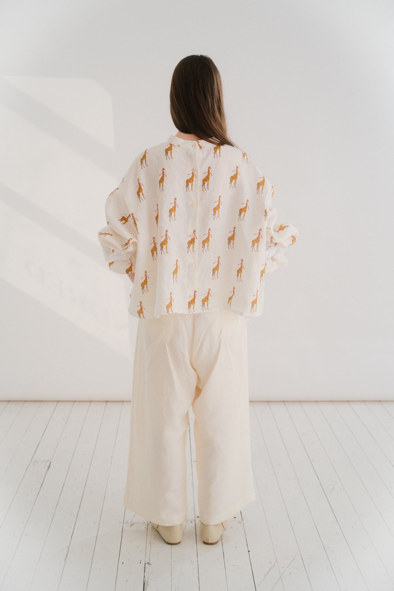 GIRAFFE PRINT SHIRT | Our most playful and fun piece from our SS24 collection. Our ‘Into The Wild’ concept was born out of an interest in the symbolism of the giraffe. Printed from a hand drawn watercolour painting by our designer Amy. Design adapted from
