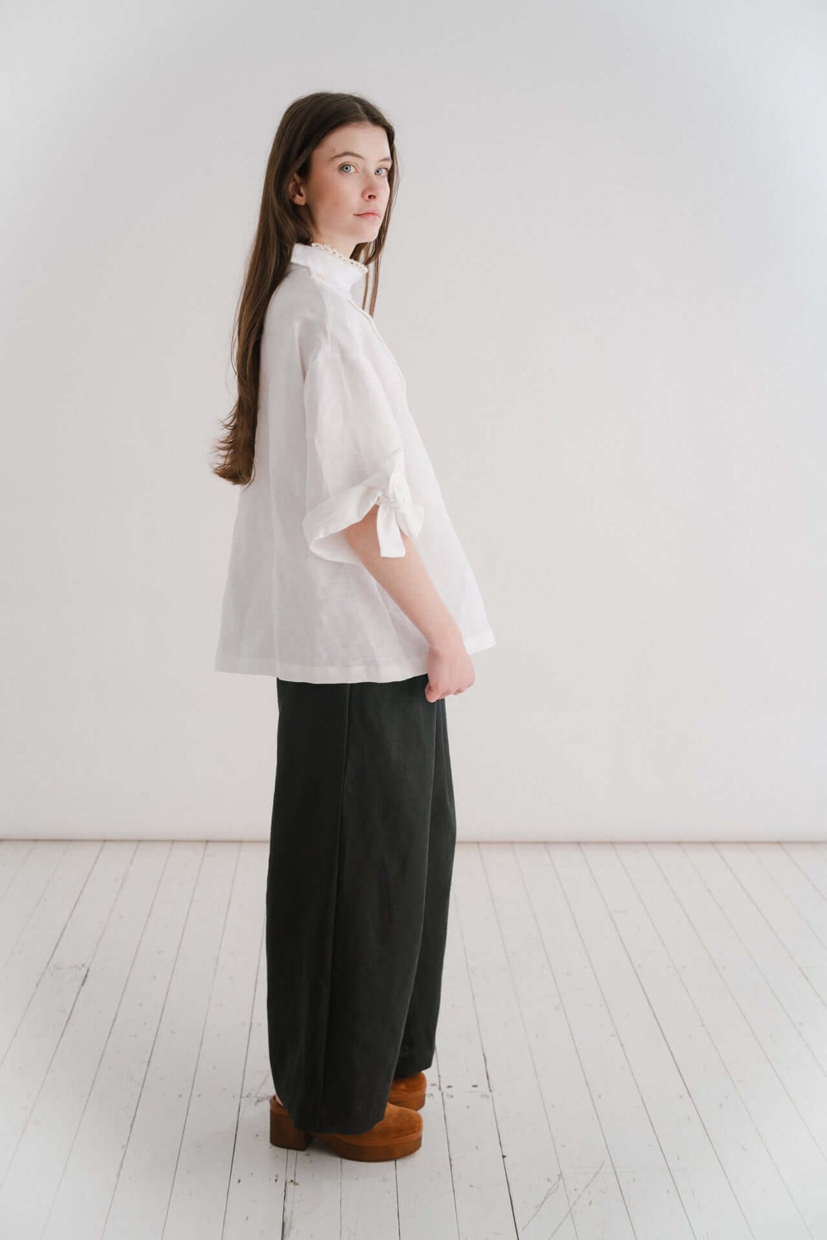 VIVIENNE | IRISH CROCHET | This is a pretty special one- the shirt you will keep forever and pass on to your kin. Created with the purest white linen, the asymetric button placket and bows on the sleeves give it a fun and modern edge, while the addition o