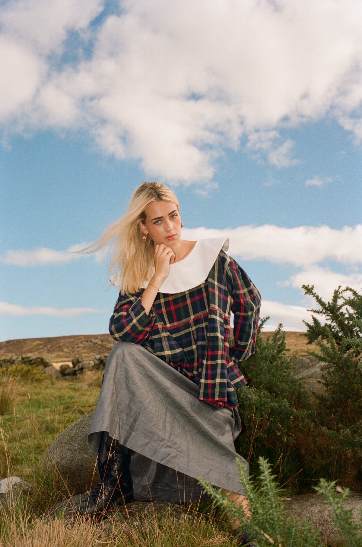 Beetled Bow Skirt in Slate styled with the Stained Glass Hallowed Blouse, seated campaign photograph by Emma Kenny.
