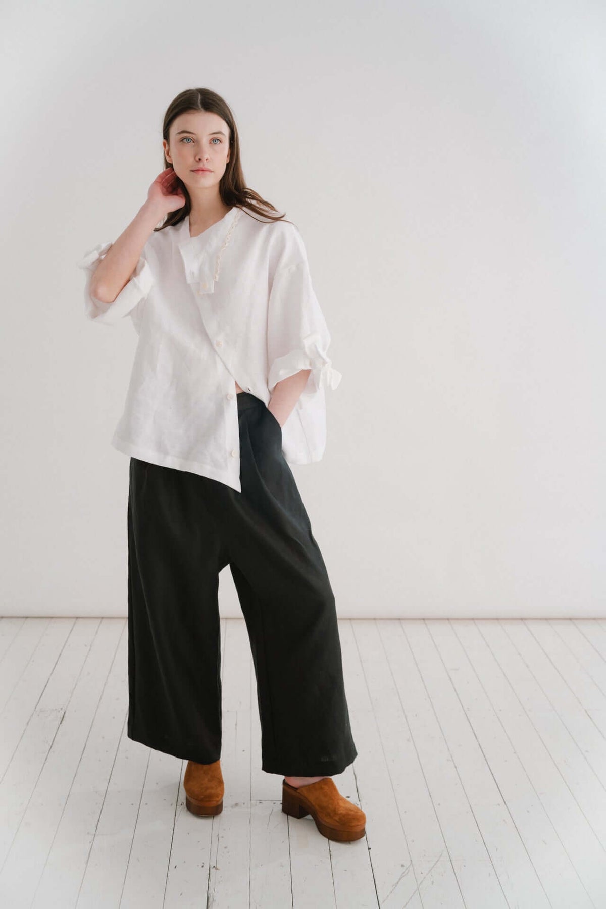 VIVIENNE | IRISH CROCHET | This is a pretty special one- the shirt you will keep forever and pass on to your kin. Created with the purest white linen, the asymetric button placket and bows on the sleeves give it a fun and modern edge, while the addition o