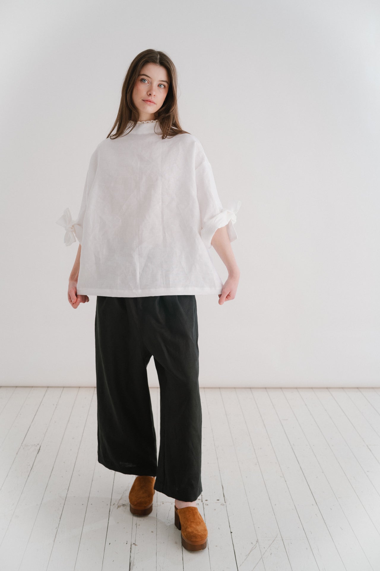 VIVIENNE | IRISH CROCHET | This is a pretty special one- the shirt you will keep forever and pass on to your kin. Created with the purest white linen, the asymetric button placket and bows on the sleeves give it a fun and modern edge, while the addition o