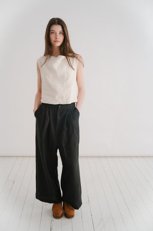 BOYFRIEND TROUSER - BLACK | The Boyfriend Trouser - a new, more tailored piece for SS24. Cut with a dropped crotch and wide leg. Contrasted with a smart waistband and pleat detail, these are so wearable yet will make you feel really put together. They pai
