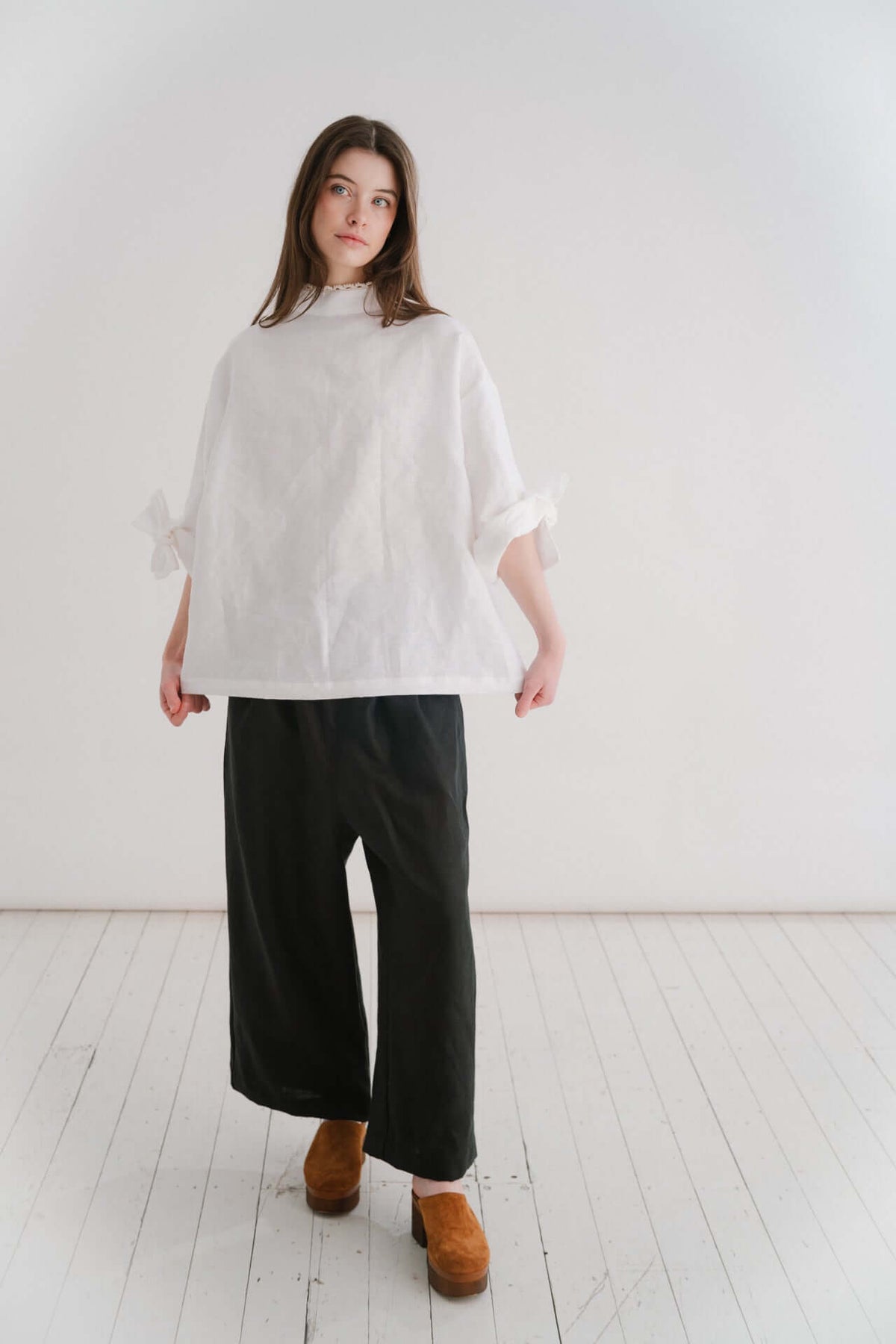 BOYFRIEND TROUSER - BLACK | The Boyfriend Trouser - a new, more tailored piece for SS24. Cut with a dropped crotch and wide leg. Contrasted with a smart waistband and pleat detail, these are so wearable yet will make you feel really put together. They pai