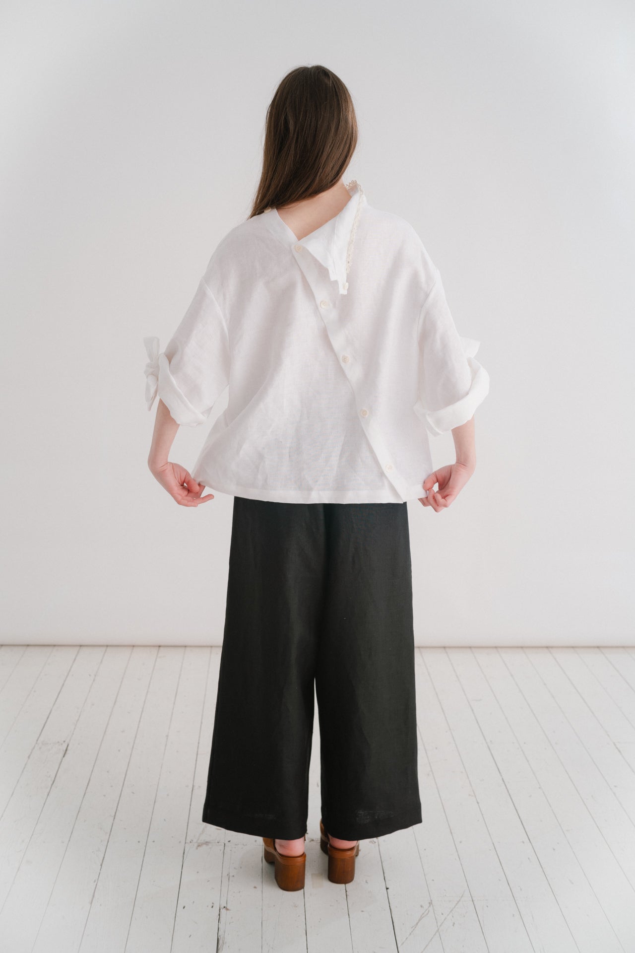 VIVIENNE | IRISH CROCHET | This is a pretty special one- the shirt you will keep forever and pass on to your kin. Created with the purest white linen, the asymetric button placket and bows on the sleeves give it a fun and modern edge, while the addition o