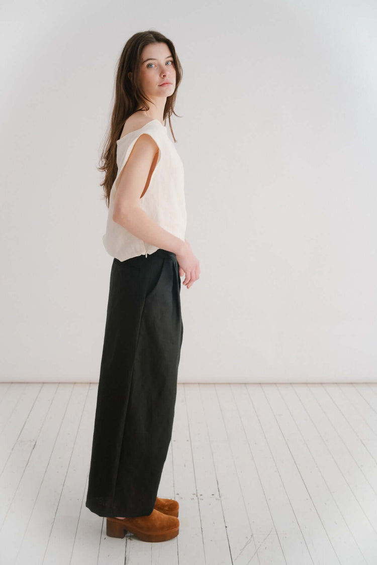 BOYFRIEND TROUSER - BLACK | The Boyfriend Trouser - a new, more tailored piece for SS24. Cut with a dropped crotch and wide leg. Contrasted with a smart waistband and pleat detail, these are so wearable yet will make you feel really put together. They pai