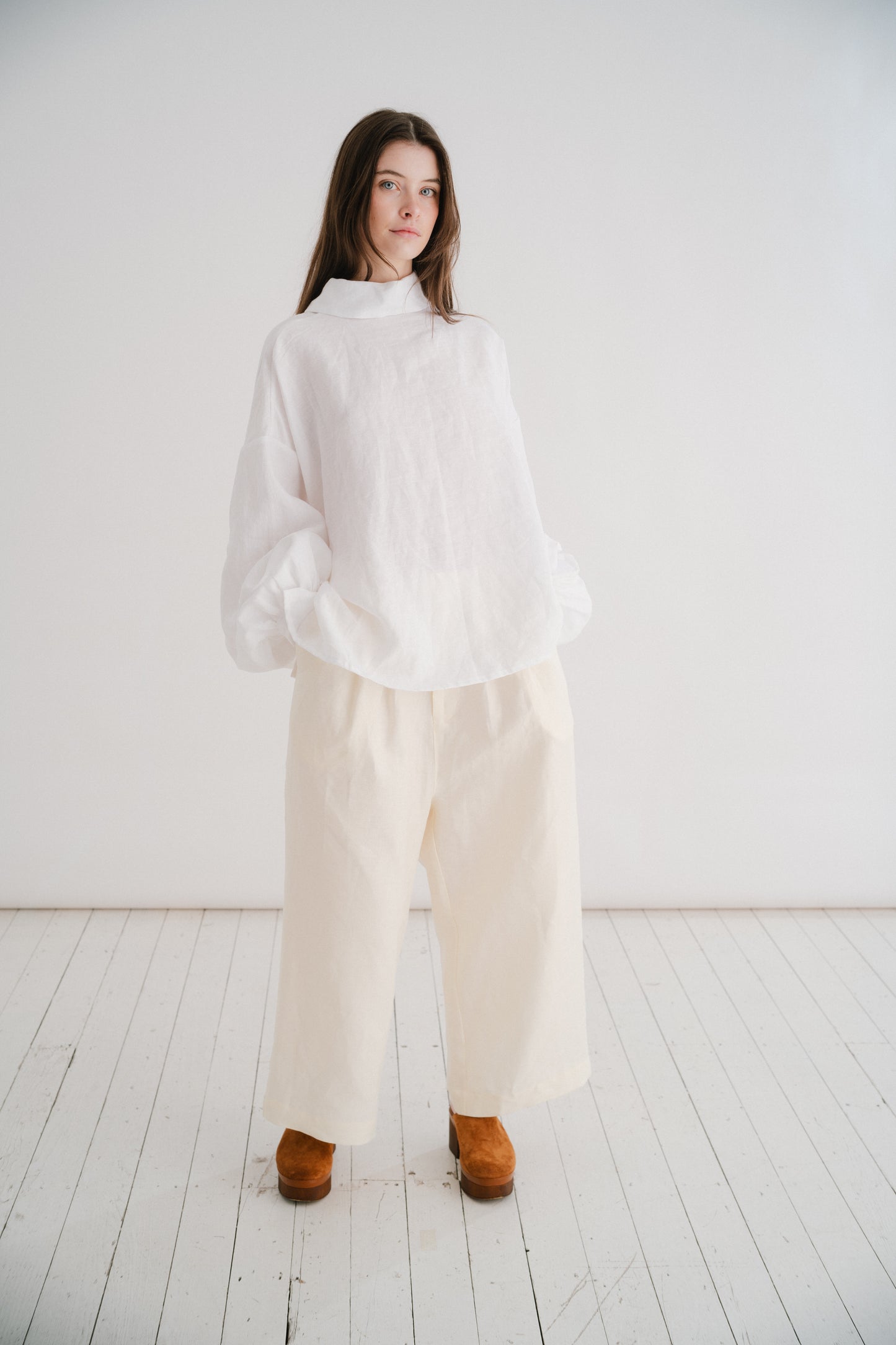 CADHLA SHIRT | WHITE | Relaxed, elegant and versatile. Cadhla - an Irish name translated as beauty. A Kindred favourite, and our first ever piece, this shirt examplifies the easy-wear ethos of the brand. Wear on one side with buttons for a beautiful dayti