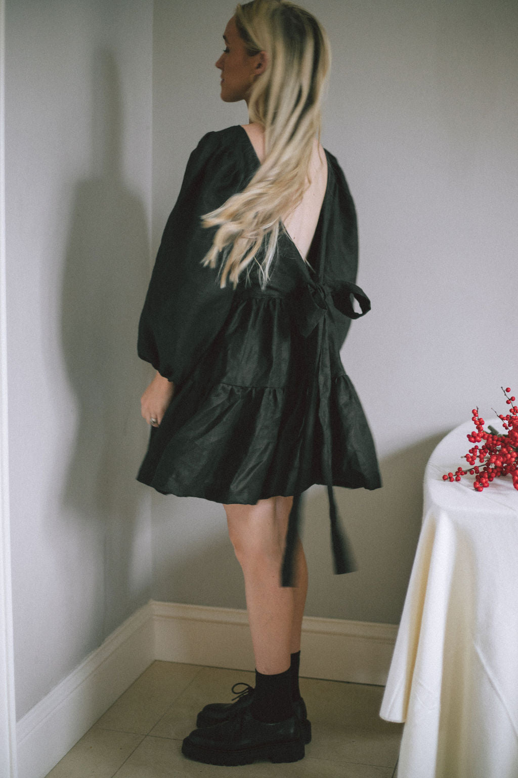 BLACK MINI BOW DRESS | Our first ever mini dress just in time for Christmas. Puff sleeves, tiered skirt and an oversized bow/low back detail. Dress up or down over the festive period and beyond. Created with black Irish linen.