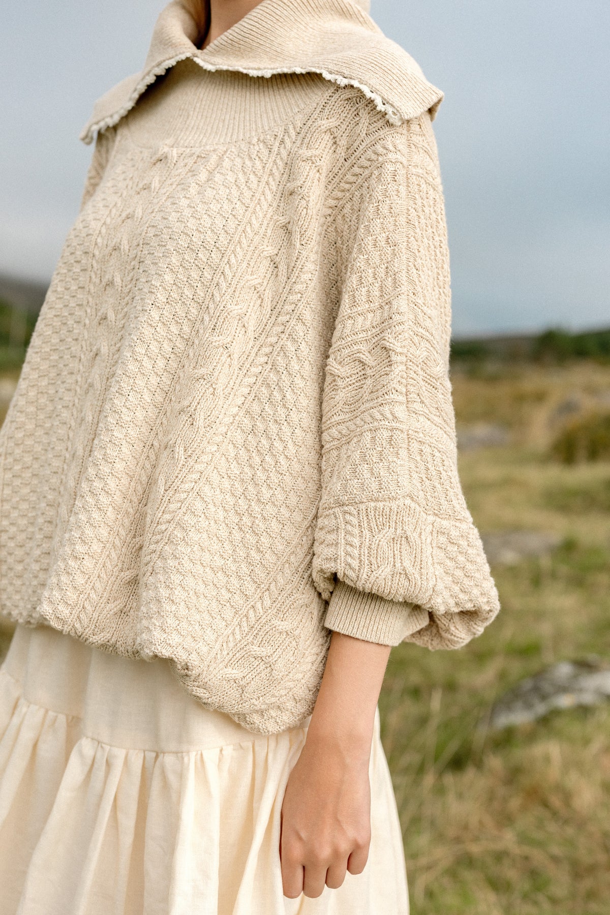 The Aran Jumper from the side, showing the full sleeve