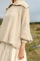 The Aran Jumper from the side, showing the full sleeve