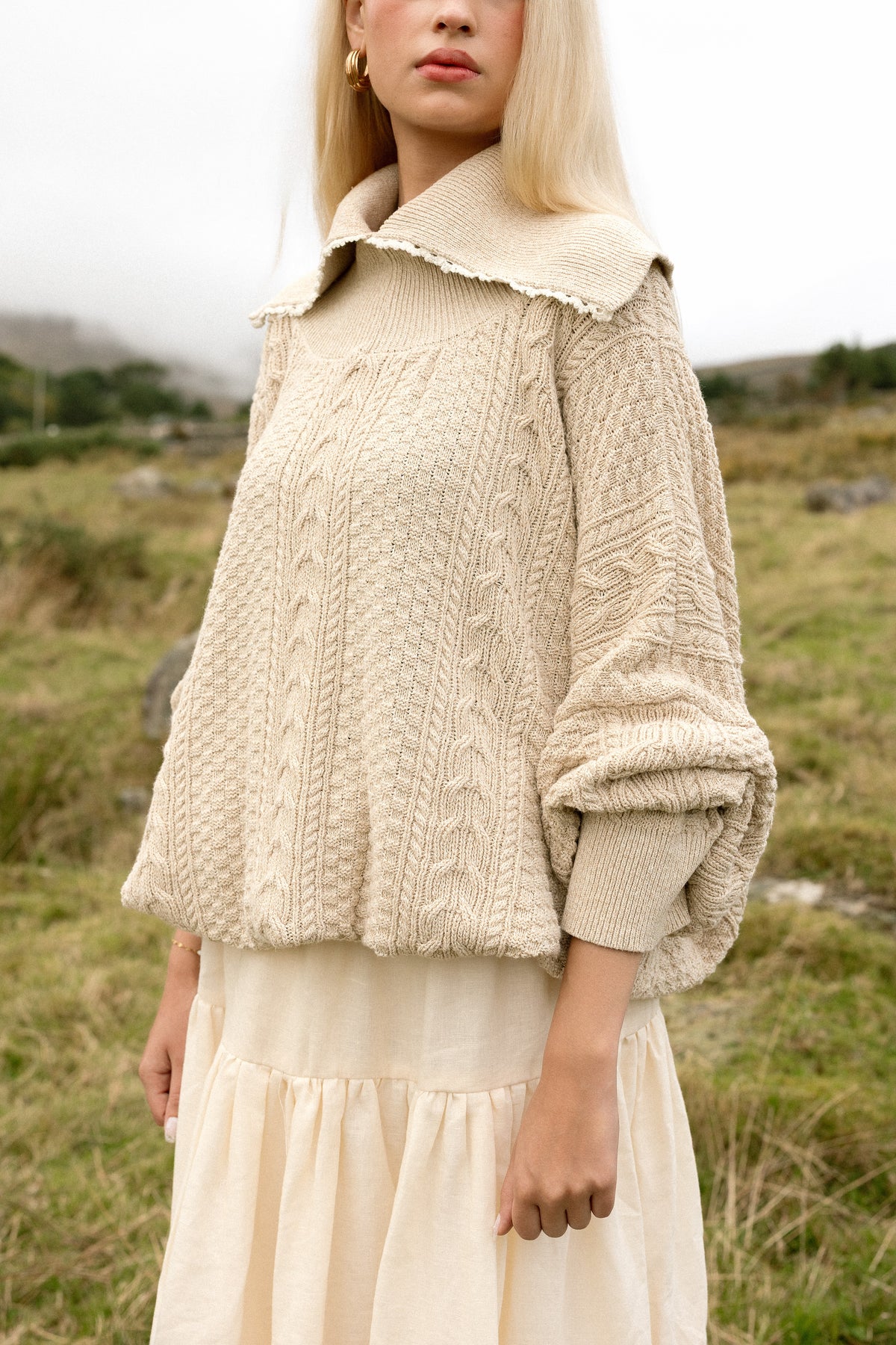 Cables running down the front of the Kindred Aran jumper