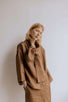 FREYA | CHOCOLATE | Our much loved Freya Blouse in an updated chocolate colour way. The shirt has an oversized collar that is secured with a tie at the back. You can play around with how the collar folds to suit your own look. In keeping with the versatil