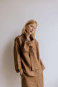 FREYA | CHOCOLATE | Our much loved Freya Blouse in an updated chocolate colour way. The shirt has an oversized collar that is secured with a tie at the back. You can play around with how the collar folds to suit your own look. In keeping with the versatil