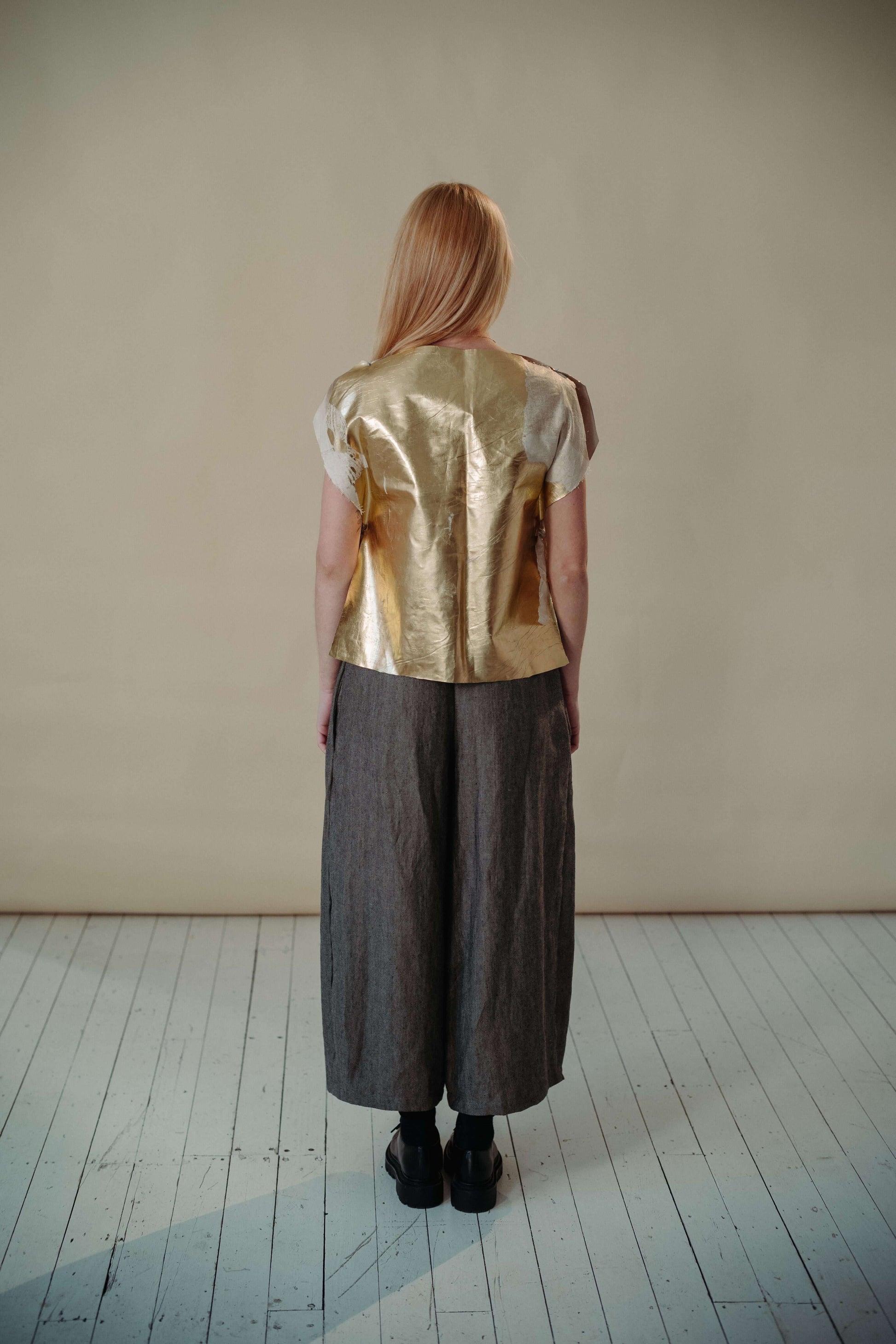 'FIND THE GOLD' VEST | Inspired by the signature golden circles of Irish artist Patrick Scott. The gold vest is the accent your staple wardrobe needs. Cut in the most simplified shape to allow the gold dry beetled linen have it's moment. Features adjustab
