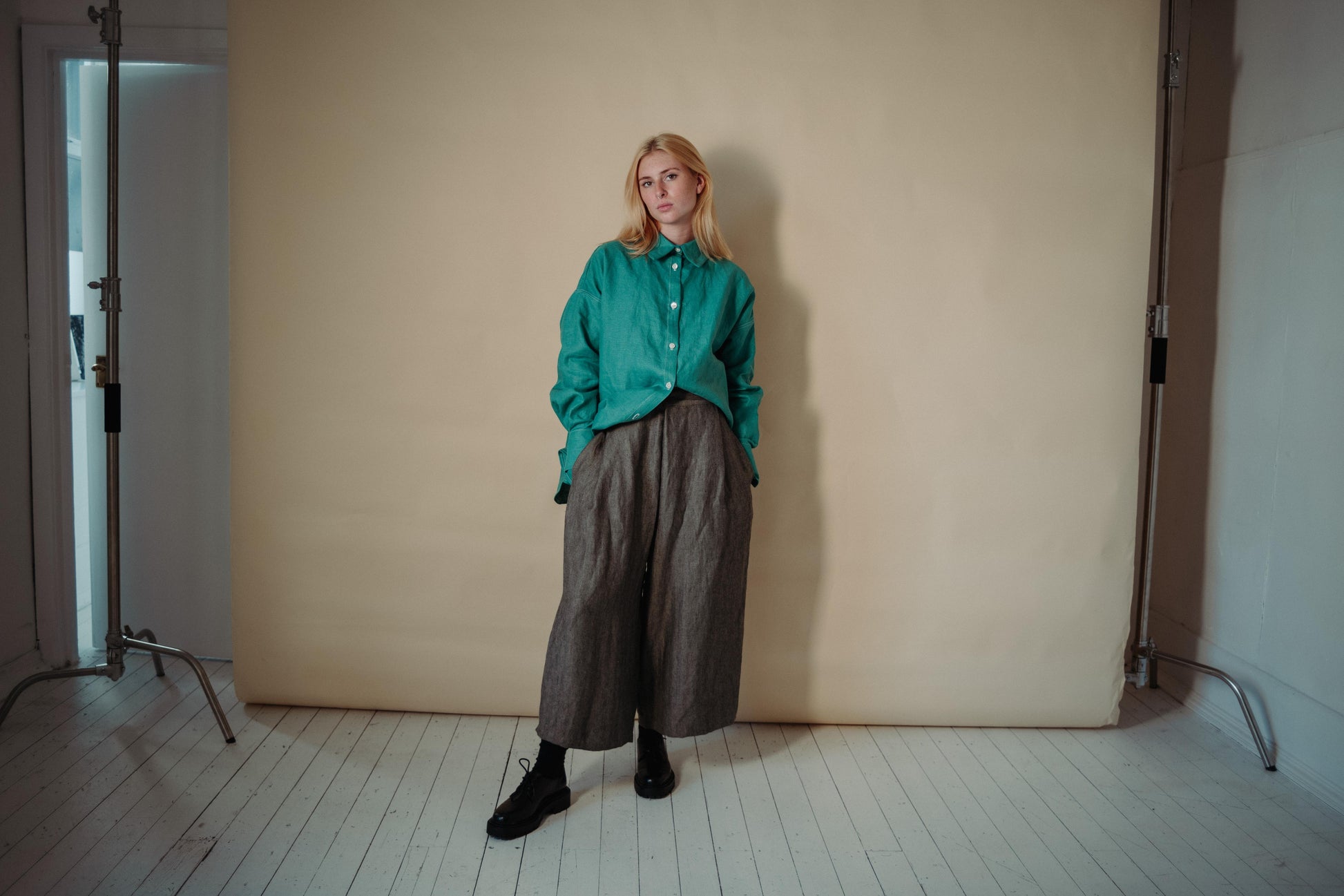 WRAP TROUSER | Our new oversized wrap trousers are created with a heavy weight herringbone linen. They feature a very slightly curved side seam and 'wrap over' detail at the waist. A little contrast gold stitching on the button hole to remind you to look