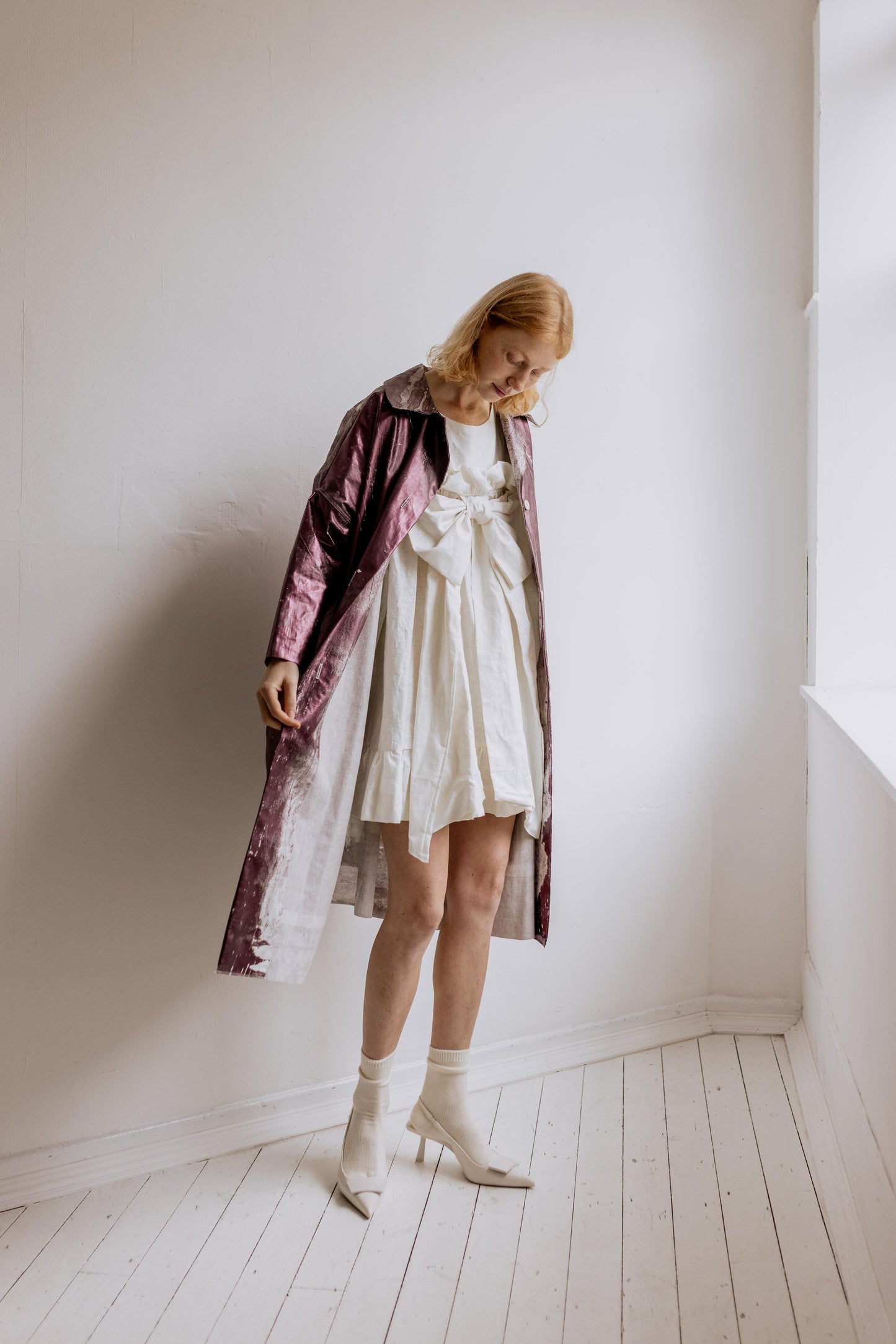 MINI BOW DRESS - PEARL | A new shape for AW23, The Bow Dress is one of our most playful. The dress is an oversized shape with gathered tiered details. The frill and bow detail at the front is the show-stopper. Cut in an oversized shape - you can wear her