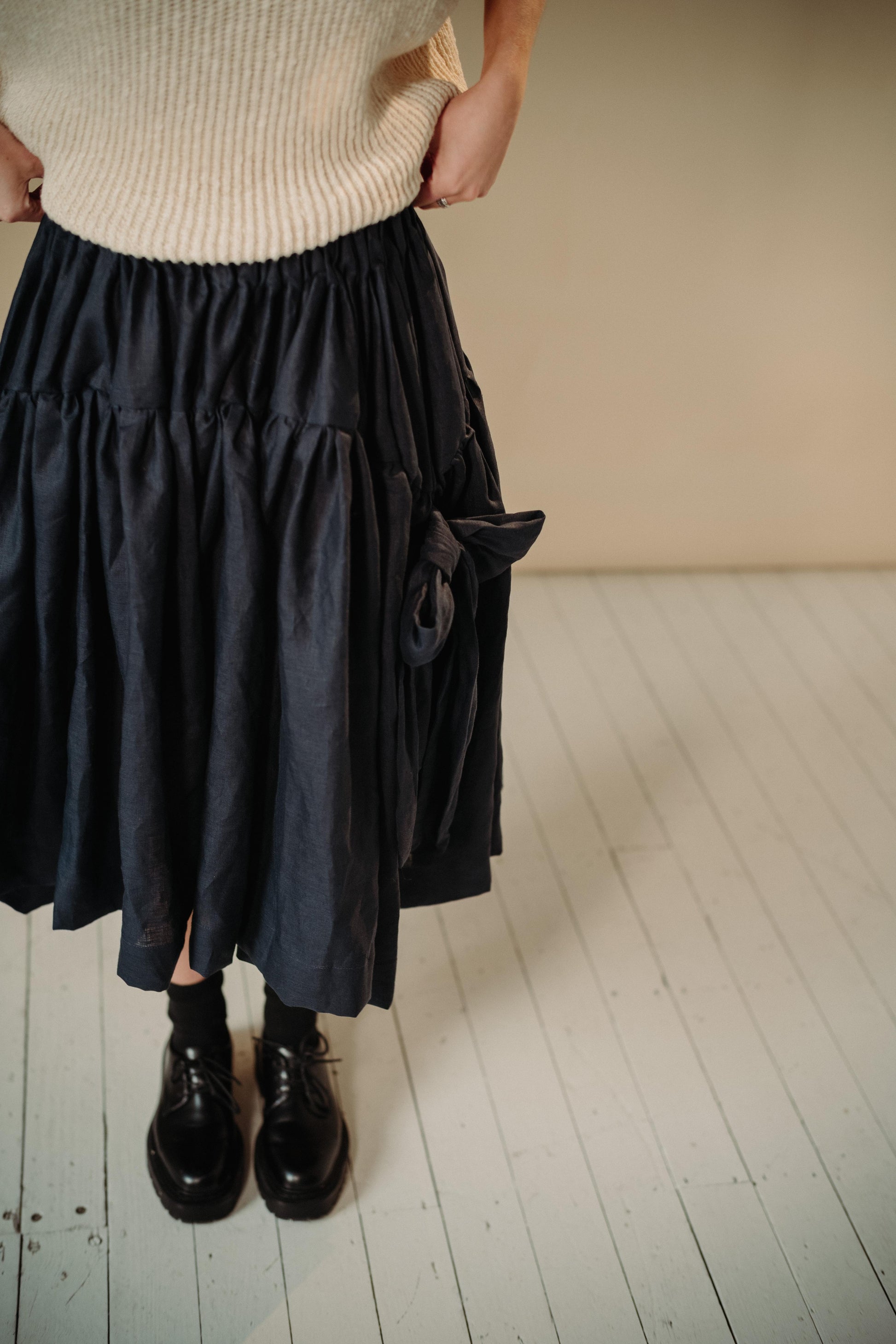 LINEN TUTU | The linen tutu - because no one ever really grows up enough to not want to wear a tutu! Voluminous, romantic and feminine, the tutu features two gathered layers with an oversized bow in a luxurious dark navy. Side seam pockets. Made with 100%