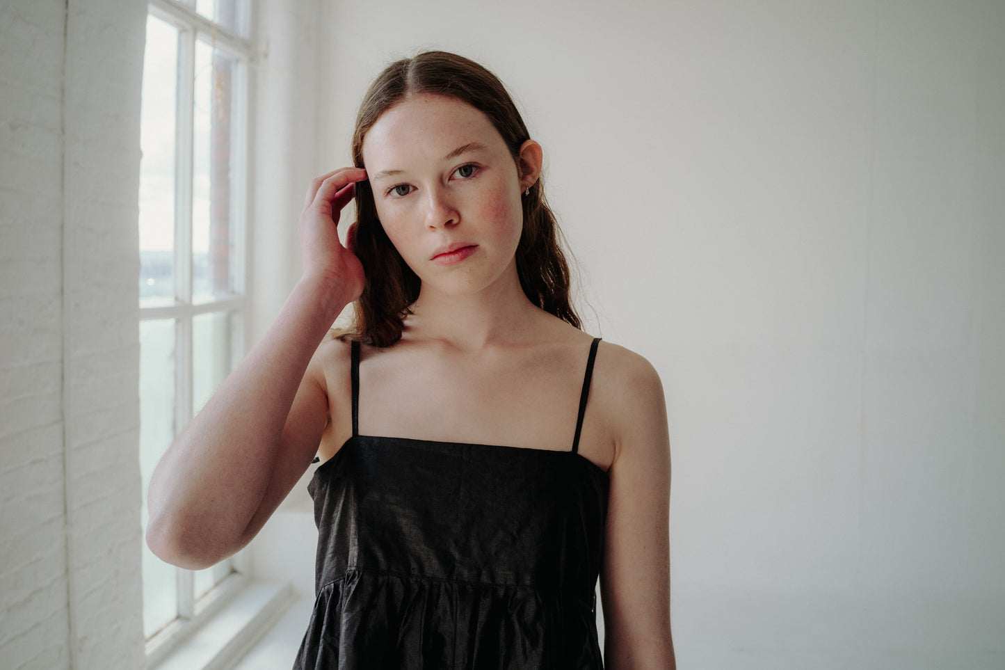 CELIA DRESS | BLACK BEETLED | Our Celia Dress is a simple, no fuss design that is easy to throw on and layer up. The voluminous gathered skirt is constrasted with a narrow bodice, featuring side seam pockets and the most delicate straps that tie in three