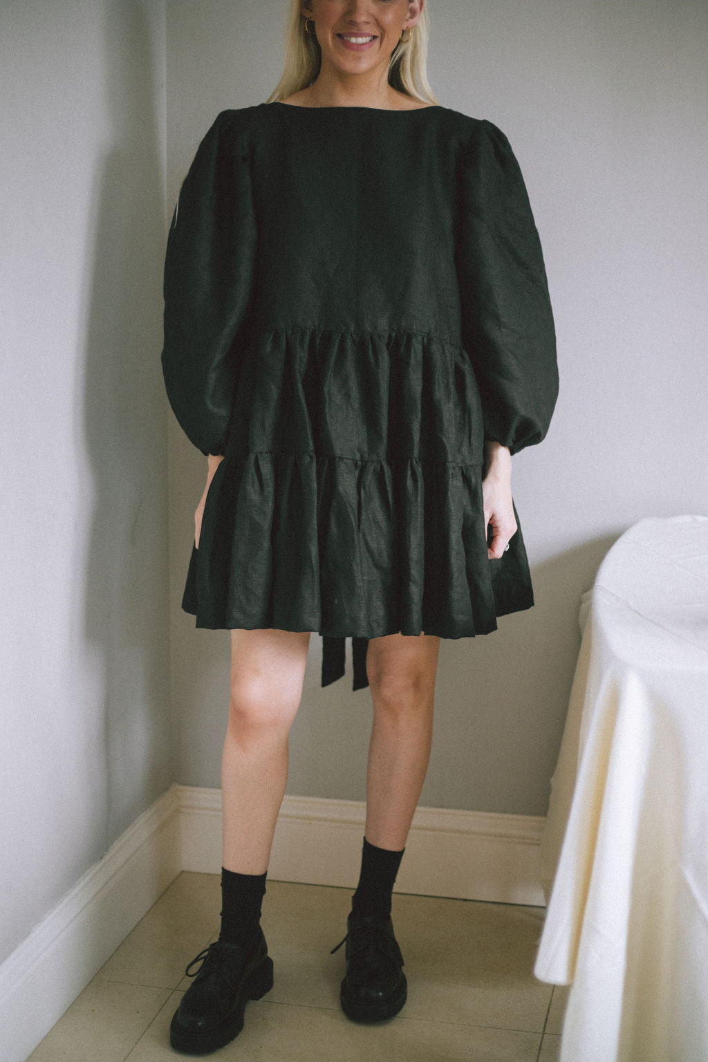 BLACK MINI BOW DRESS | Our first ever mini dress just in time for Christmas. Puff sleeves, tiered skirt and an oversized bow/low back detail. Dress up or down over the festive period and beyond. Created with black Irish linen.