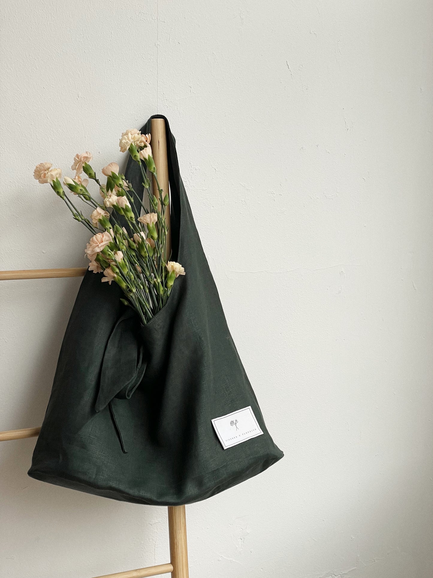 KINDRED x FLOURISH SHOPPER | This year to mark Anti-Slavery week, we have collaborated with our partner charity Flourish NI to create a new linen shopper - available in both forest green and patchwork. 'Being rescued from human trafficking is only the beg