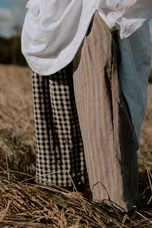 AMELIA TROUSERS | PATCHWORK | Our new patchwork amelia trousers with contrasting legs. Created with soft tumbled Irish linen in black/natural gingham and lavender/olive stripe. Oversized fit, elasticated waist and side seam pockets.