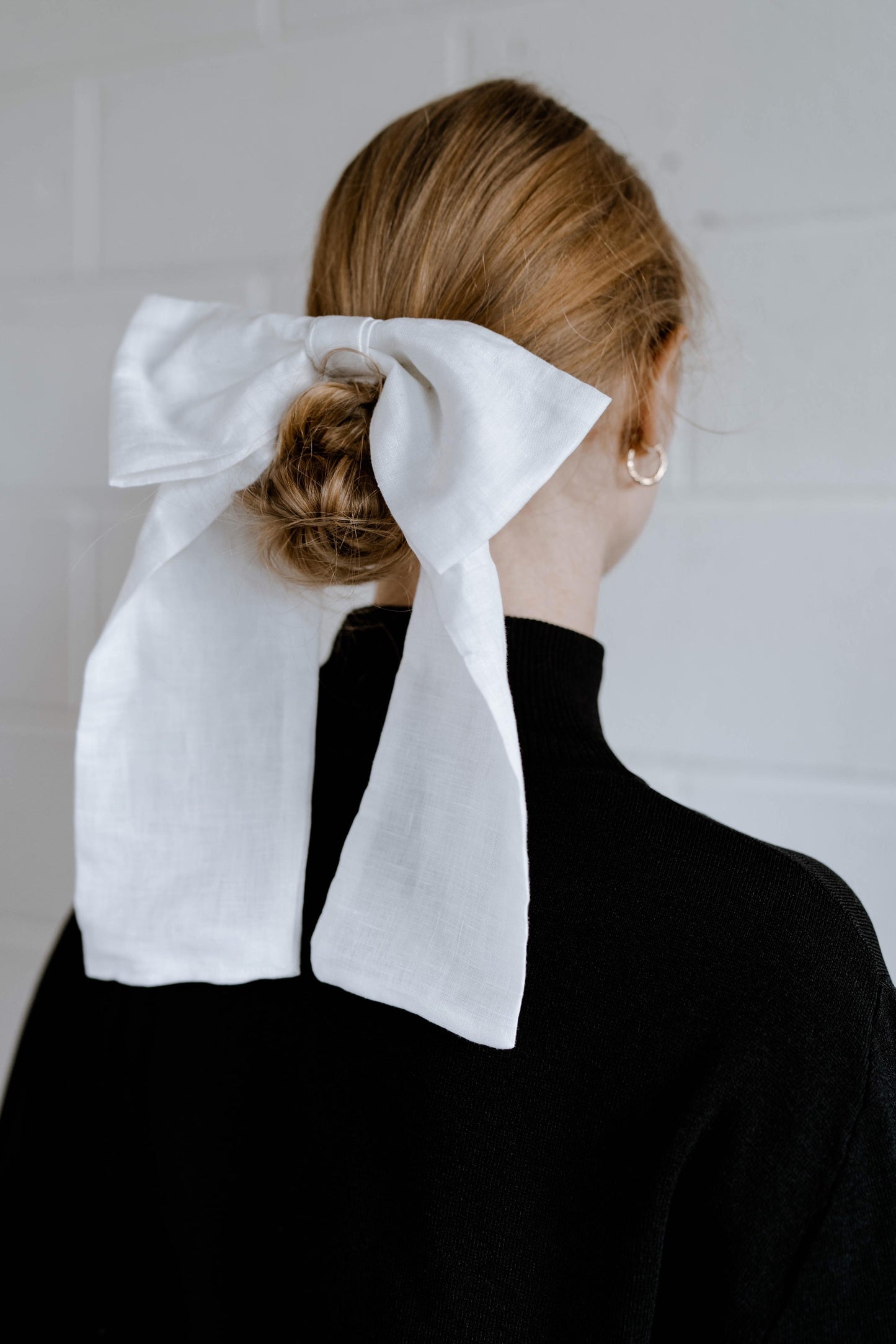 CLARA BOW | A bow fit for a Queen Make a statement from every angle with our oversized linen bow. Clara will make you stand tall like the Queen you are. The Clara has even been known to accompany brides down the aisle! Attach to hair with a 4cm French bar