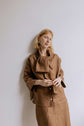 FREYA | CHOCOLATE | Our much loved Freya Blouse in an updated chocolate colour way. The shirt has an oversized collar that is secured with a tie at the back. You can play around with how the collar folds to suit your own look. In keeping with the versatil