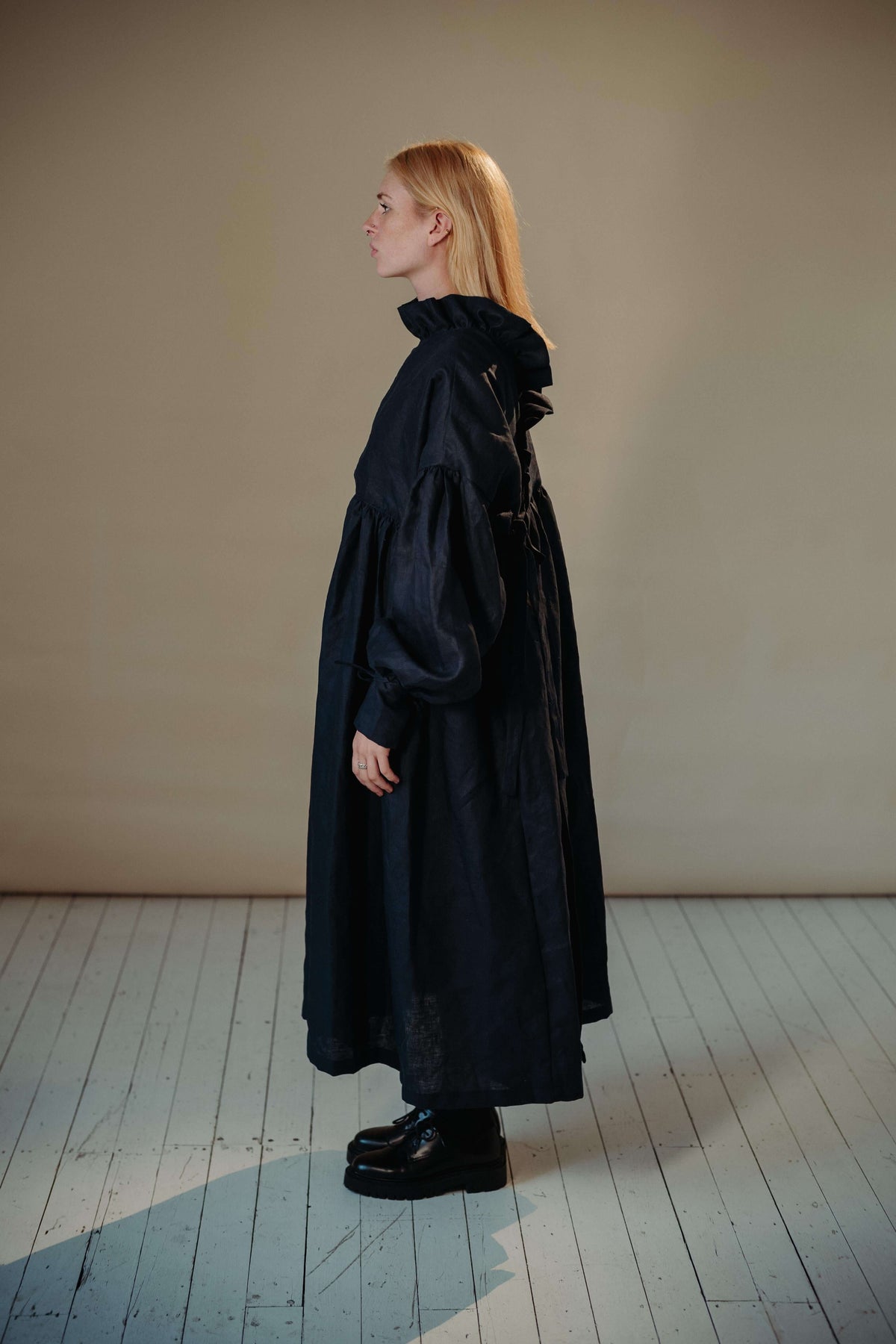 CAMILLE DRESS | NAVY | She has become one of our signature pieces, so we thought it only right to offer a wintery navy version. Camille is a delight to wear. A wrap dress that features a ruffle collar, balloon sleeves and a bow cuff detail. The dress can