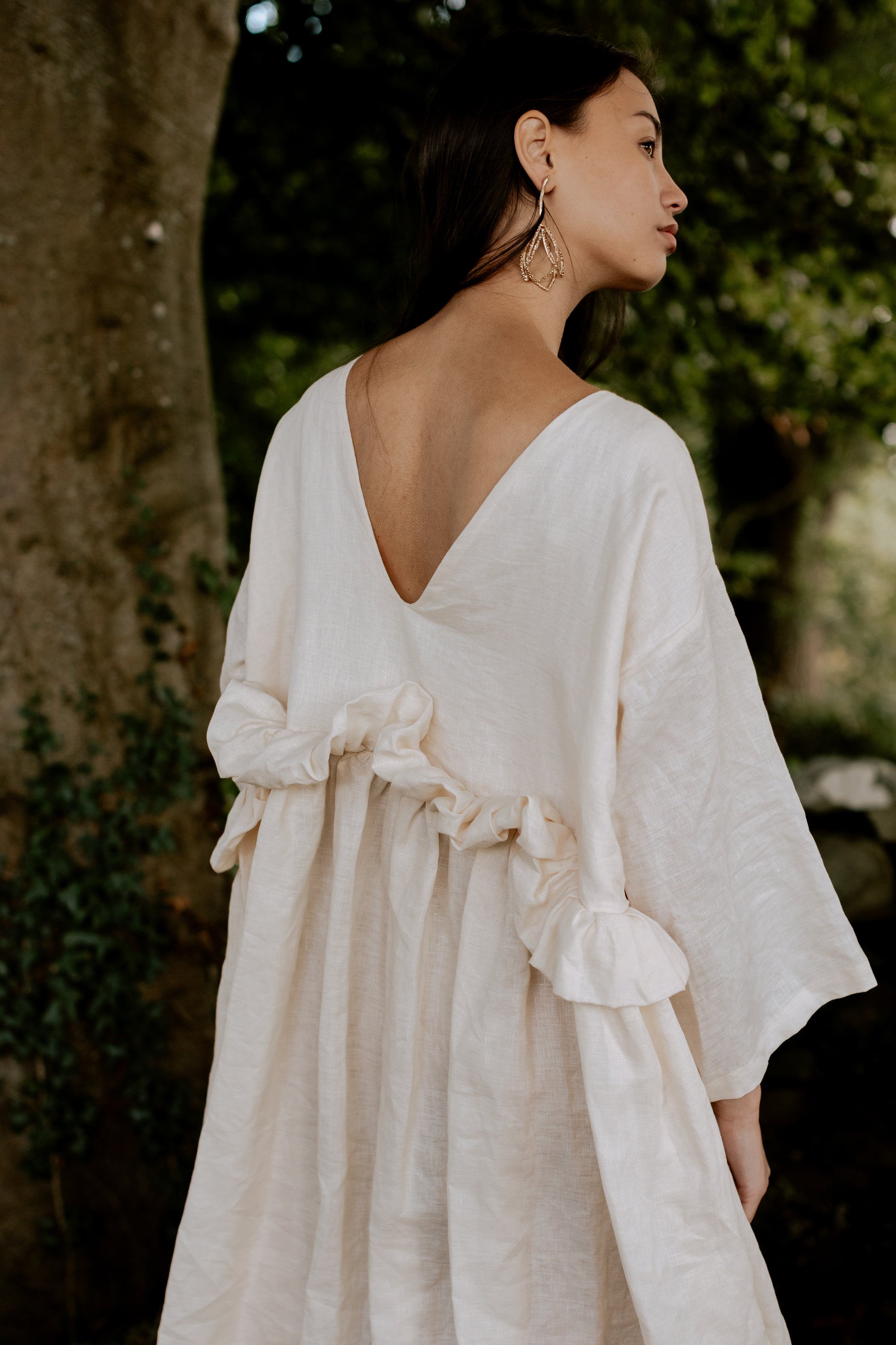 THE PUFF DRESS | MALLOW | Our playful party dress this season.An effortless and feminine silhouette with a playful burst of puffed linen at the waist. Can be worn both ways, with 'V' to the front or back. The 'mallow' colourway features a subtle line of g