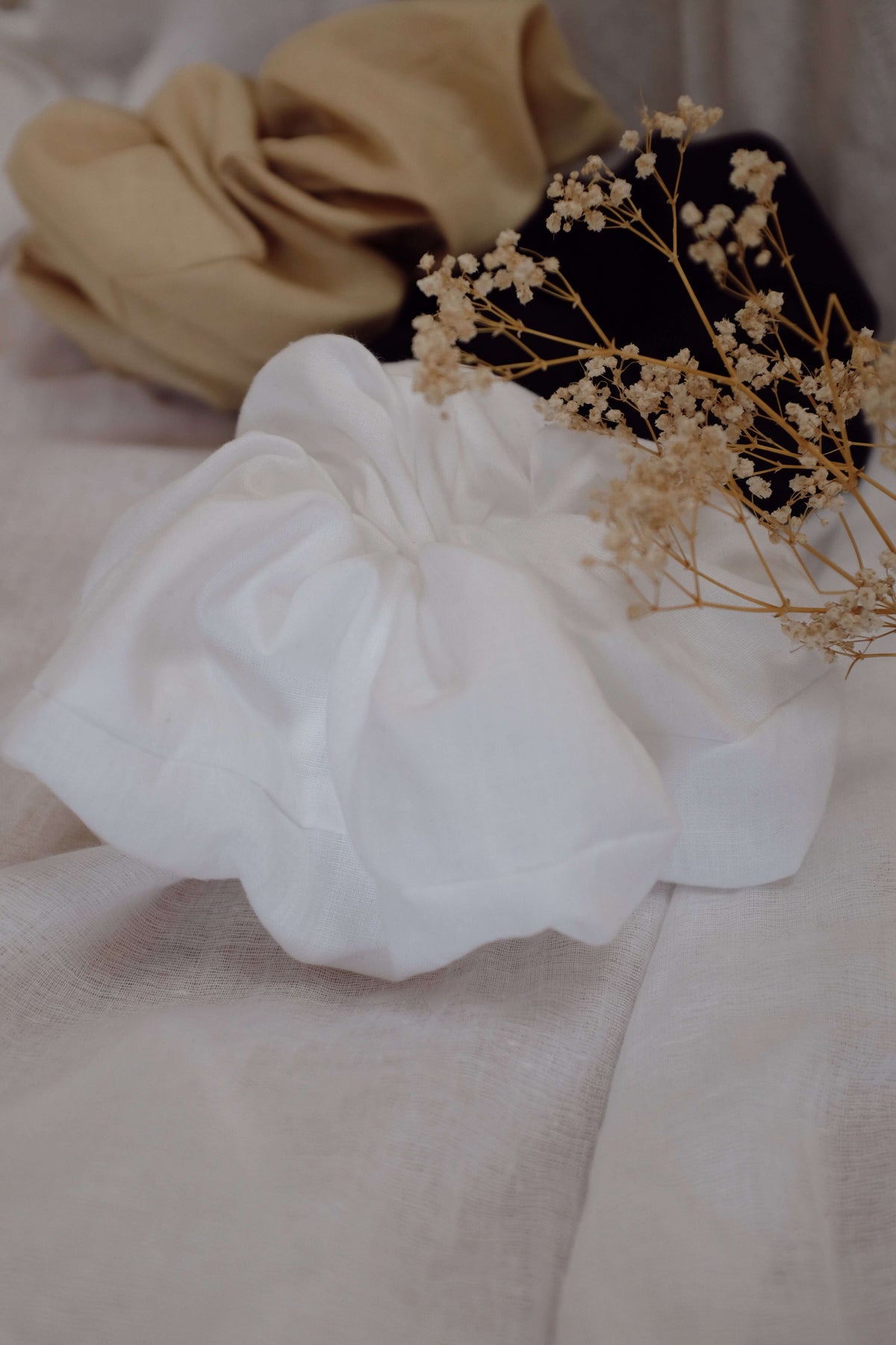 CLOUD SCRUNCHIE | For those ‘head in the clouds’ days. This 'extra' hair accessory was created to match the size of your dreams! Oversized scrunchies that look as good on your arm as they do in your hair. Coming in three colour-ways, these will become a s