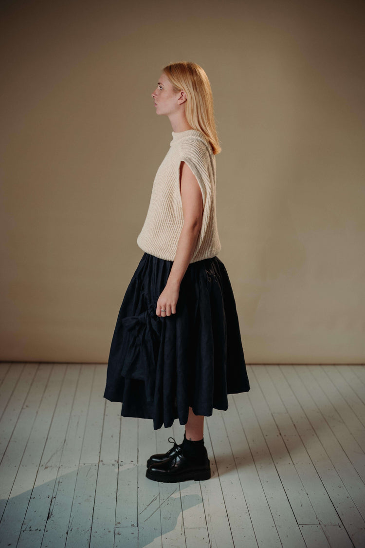 LINEN TUTU | The linen tutu - because no one ever really grows up enough to not want to wear a tutu! Voluminous, romantic and feminine, the tutu features two gathered layers with an oversized bow in a luxurious dark navy. Side seam pockets. Made with 100%