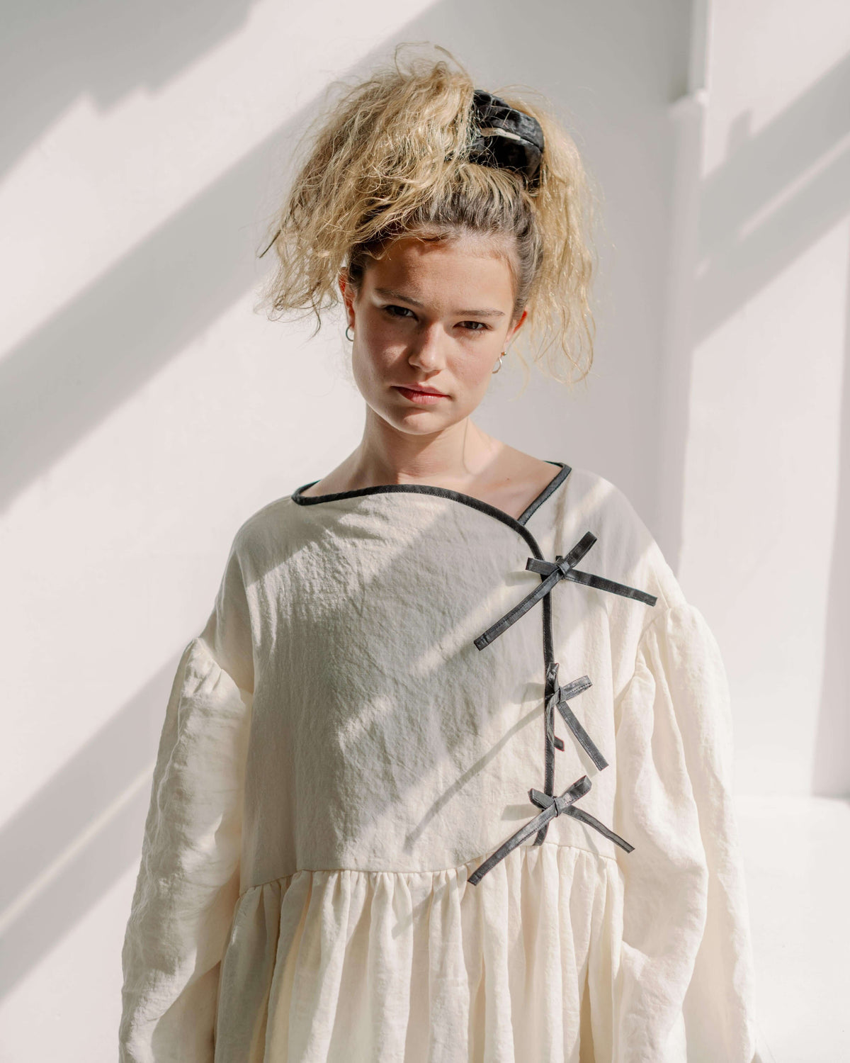 TIFFANY DRESS | A new style for AW23, we have fallen in love with the simplicity and elegance of Tiffany. True to our effortless yet elevated signature, Tiffany feels relaxed and oversized yet holds those special elements of delicate binding and bow faste