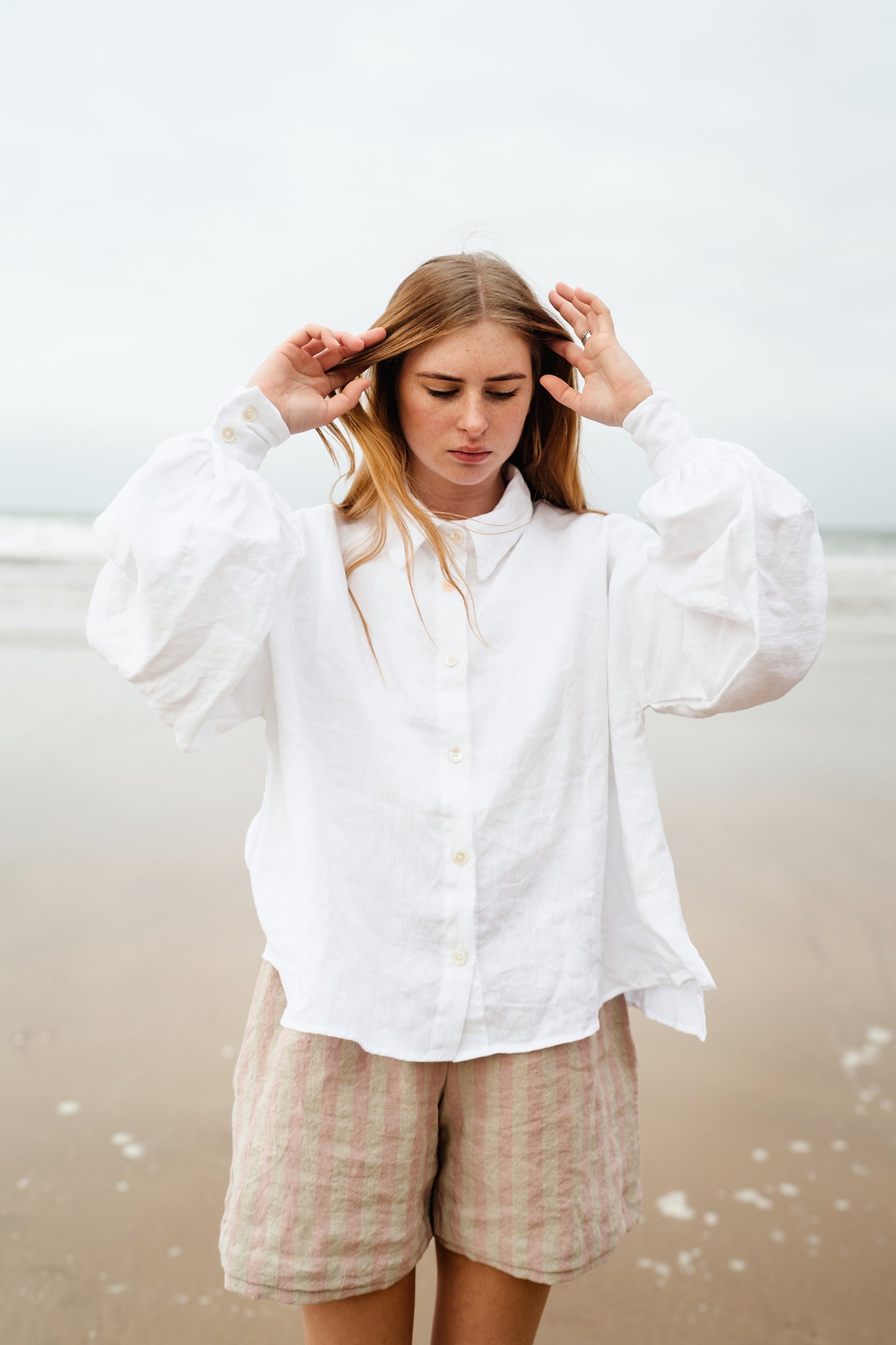 CADHLA SHIRT | WHITE | Relaxed, elegant and versatile. Cadhla - an Irish name translated as beauty. A Kindred favourite, and our first ever piece, this shirt examplifies the easy-wear ethos of the brand. Wear on one side with buttons for a beautiful dayti