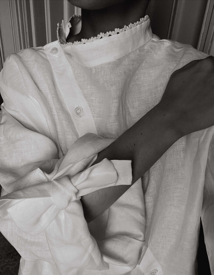 VIVIENNE | IRISH CROCHET | This is a pretty special one- the shirt you will keep forever and pass on to your kin. Created with the purest white linen, the asymetric button placket and bows on the sleeves give it a fun and modern edge, while the addition o