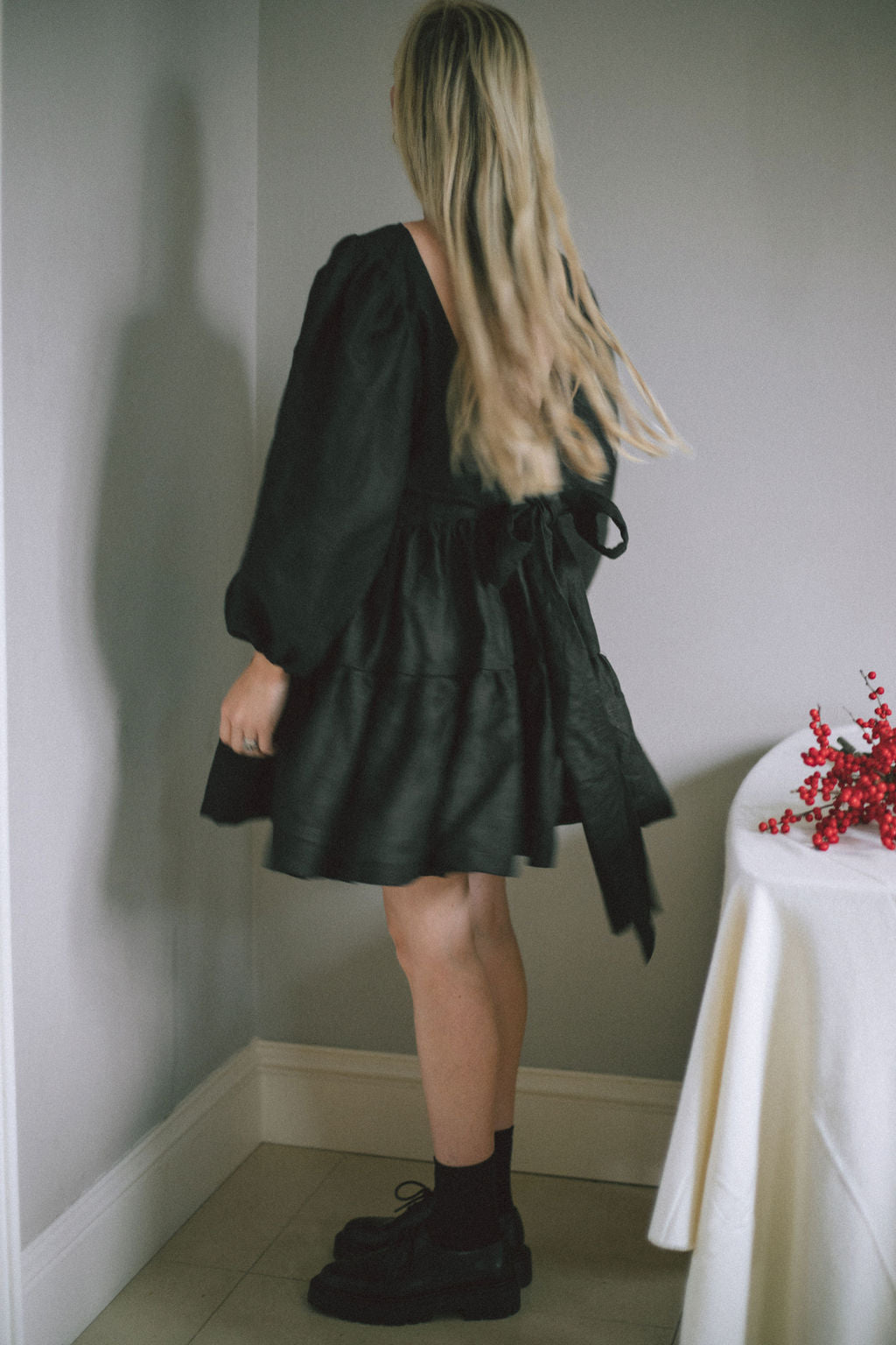 BLACK MINI BOW DRESS | Our first ever mini dress just in time for Christmas. Puff sleeves, tiered skirt and an oversized bow/low back detail. Dress up or down over the festive period and beyond. Created with black Irish linen.