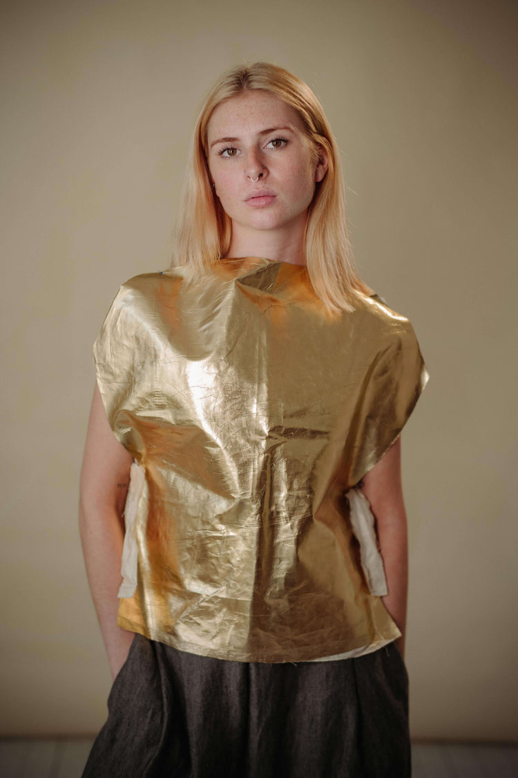 'FIND THE GOLD' VEST | Inspired by the signature golden circles of Irish artist Patrick Scott. The gold vest is the accent your staple wardrobe needs. Cut in the most simplified shape to allow the gold dry beetled linen have it's moment. Features adjustab