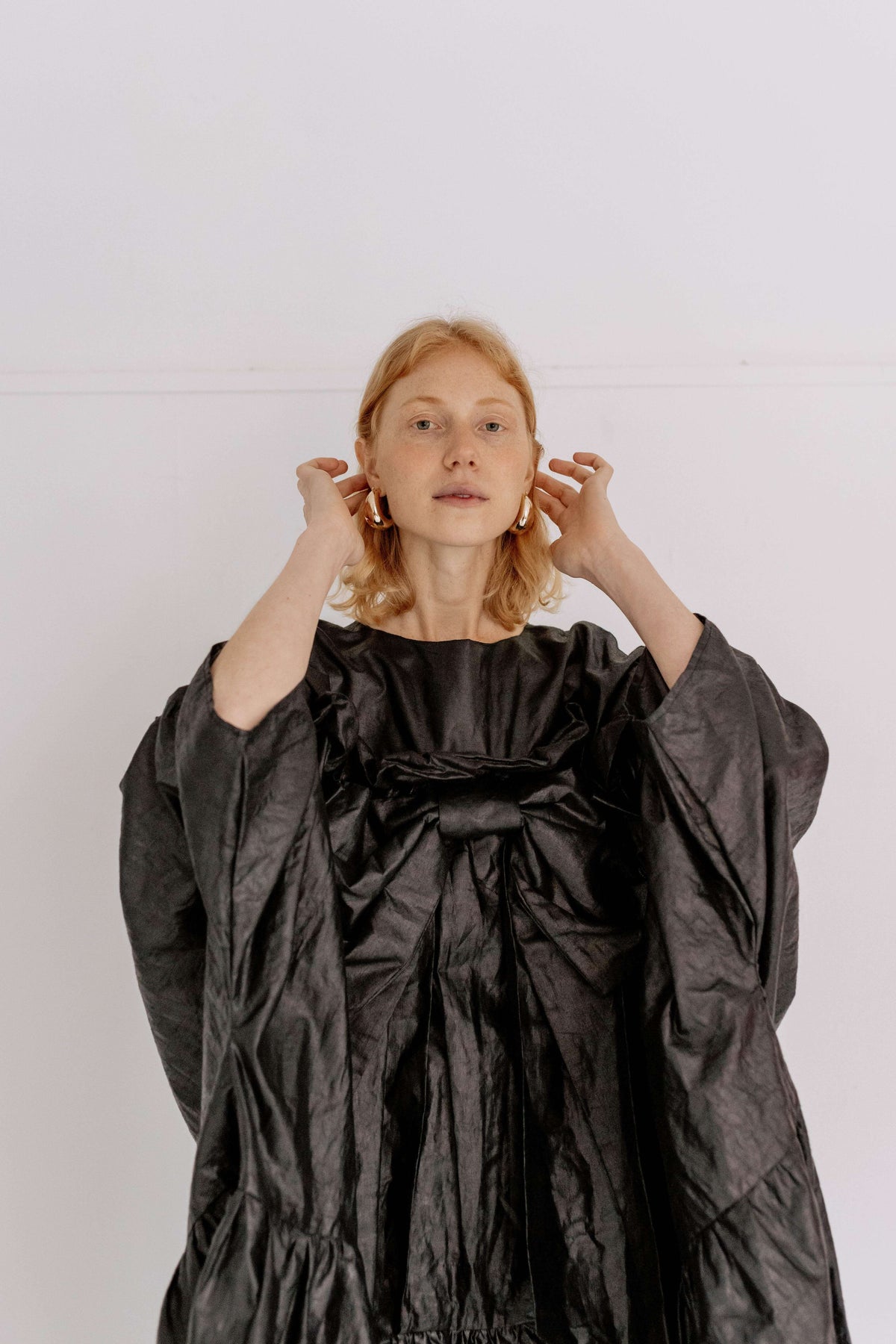 BOW DRESS | BLACK BEETLED | Our one stop, maximum impact party season dress. Based on the silhouette of our Leila dress, we have added length for a more dramatic shape. The black beetled linen gives a unique sheen that gives this dress such a fun edge. An