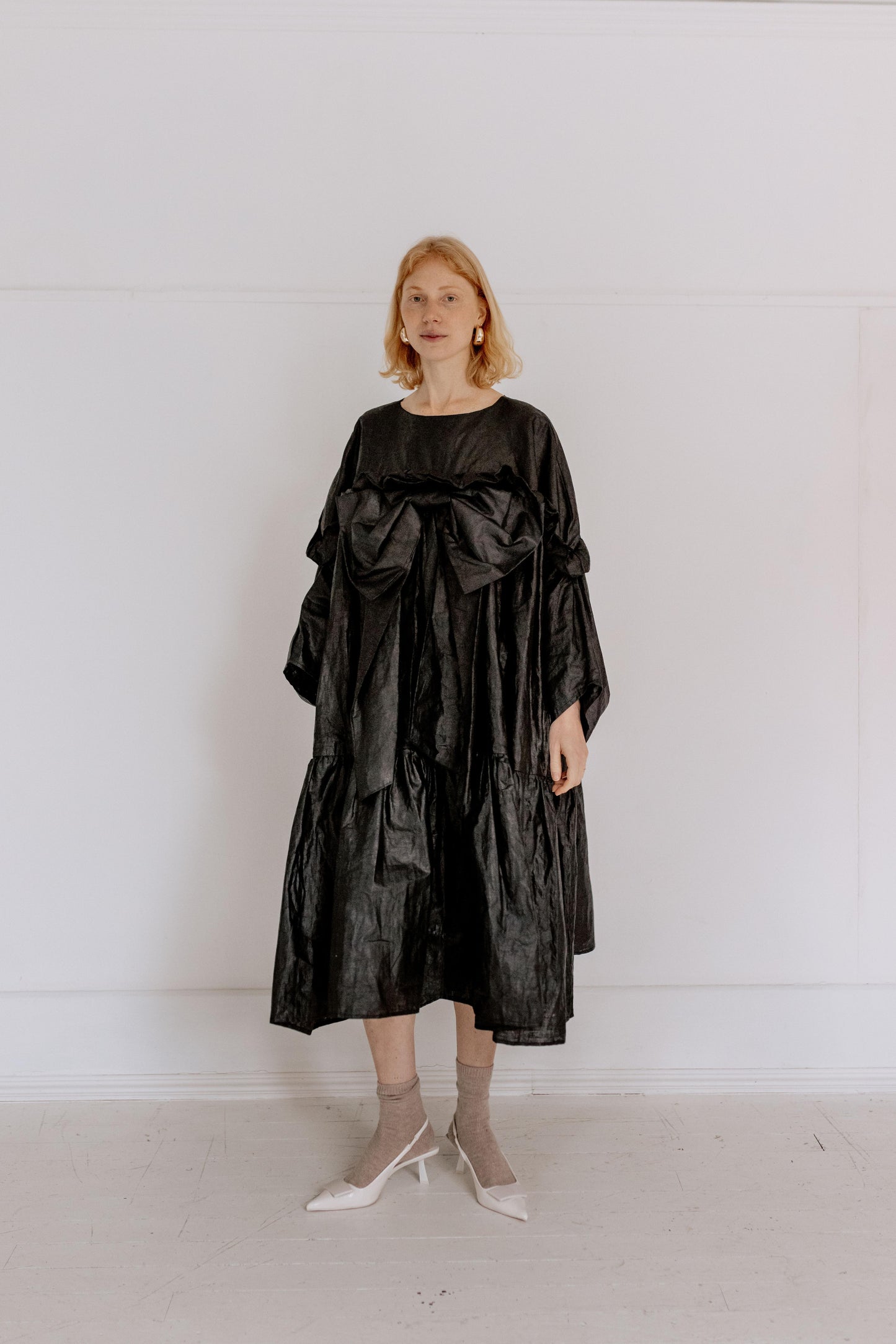 BOW DRESS | BLACK BEETLED | Our one stop, maximum impact party season dress. Based on the silhouette of our Leila dress, we have added length for a more dramatic shape. The black beetled linen gives a unique sheen that gives this dress such a fun edge. An