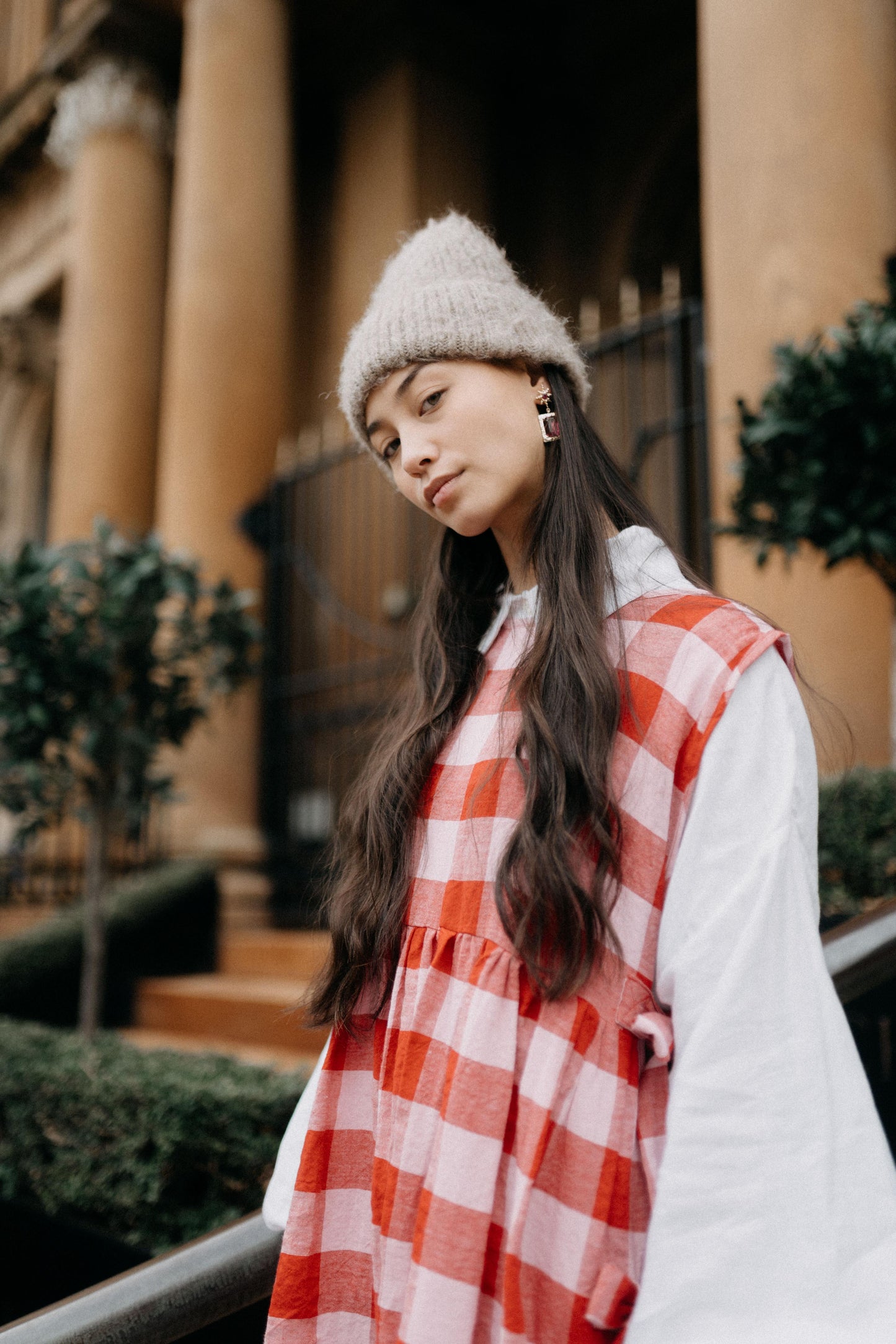 PINAFORE | PINK/RED CHECK | ONLY AVAILABLE FOR CHRISTMAS DELIVERY IF ORDERED FROM THE U.K.Our new pinafore is a really fun layering piece for the festive season. Featuring three bows on each side, she can be worn as a dress or layered over our Cadhla shir