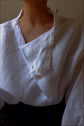 VIVIENNE | IRISH CROCHET | This is a pretty special one- the shirt you will keep forever and pass on to your kin. Created with the purest white linen, the asymetric button placket and bows on the sleeves give it a fun and modern edge, while the addition o