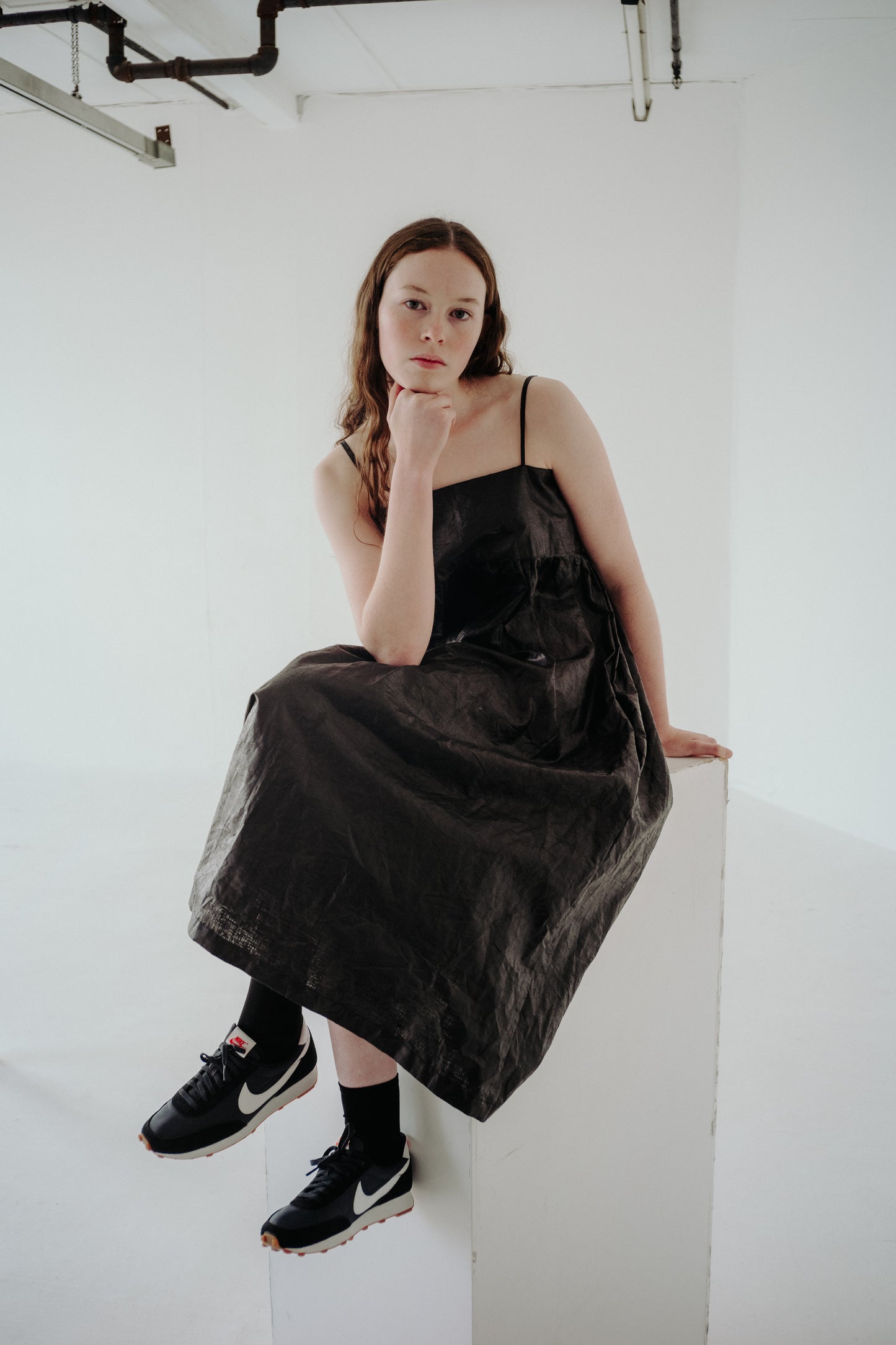 CELIA DRESS | BLACK BEETLED | Our Celia Dress is a simple, no fuss design that is easy to throw on and layer up. The voluminous gathered skirt is constrasted with a narrow bodice, featuring side seam pockets and the most delicate straps that tie in three